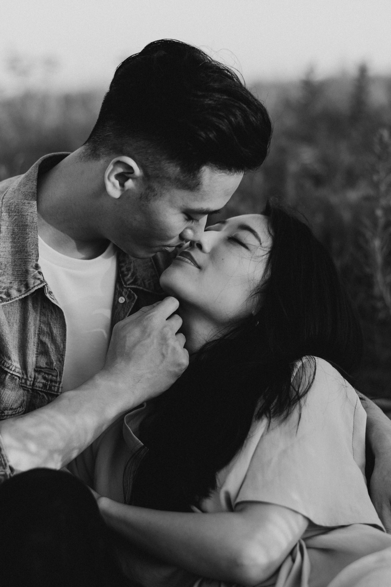 Black and white picture of couple almost kissing