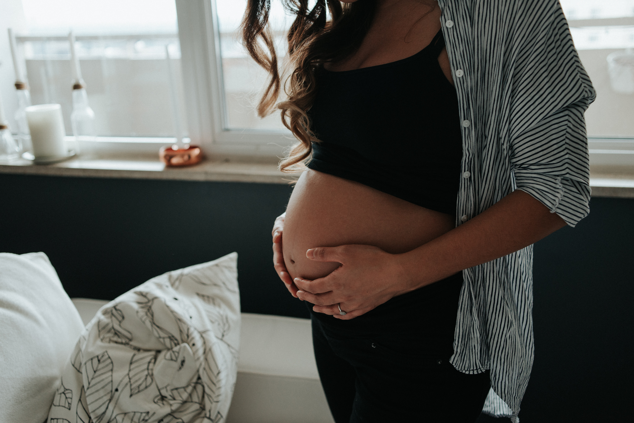 A cozy in home maternity shoot with a gorgeous couple in their beautifully styled Toronto condo // Photographed by Toronto Wedding Photographer Daring Wanderer