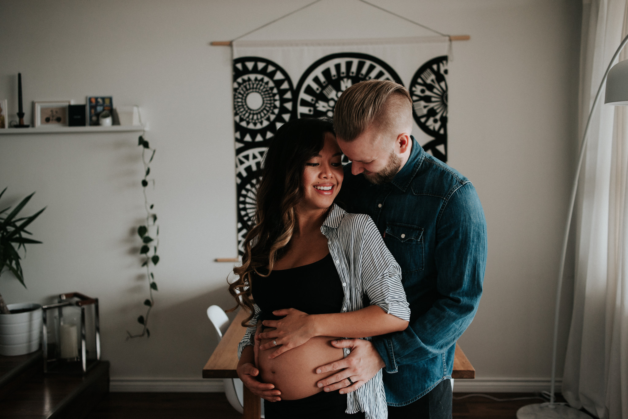 A cozy in home maternity shoot with a gorgeous couple in their beautifully styled Toronto condo // Photographed by Toronto Wedding Photographer Daring Wanderer