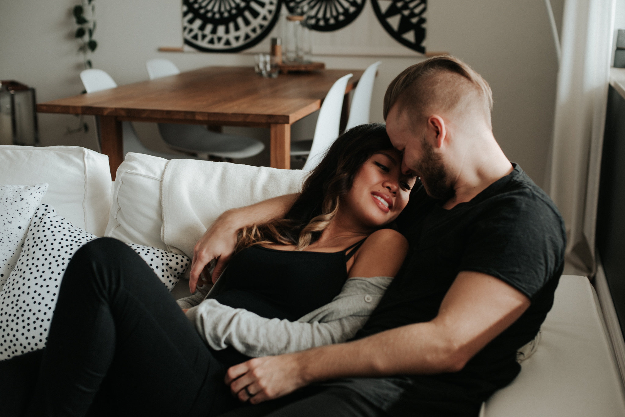 A cozy in home maternity shoot with a gorgeous couple in their beautifully styled Toronto condo // Photographed by Toronto Wedding Photographer Daring Wanderer