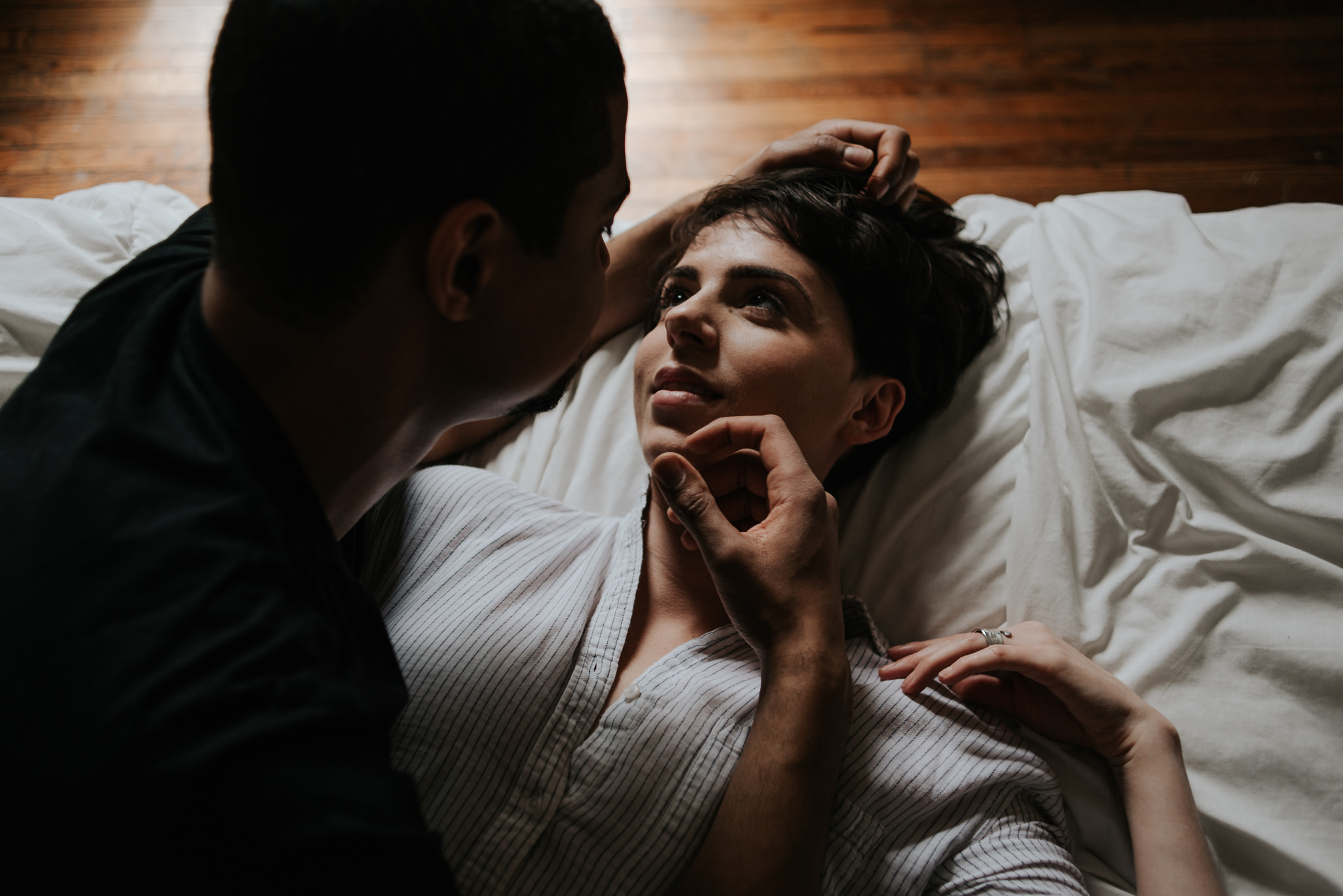 Young lovers lying in bed in bohemian apartment // Downtown Toronto Couple Shoot by Daring Wanderer