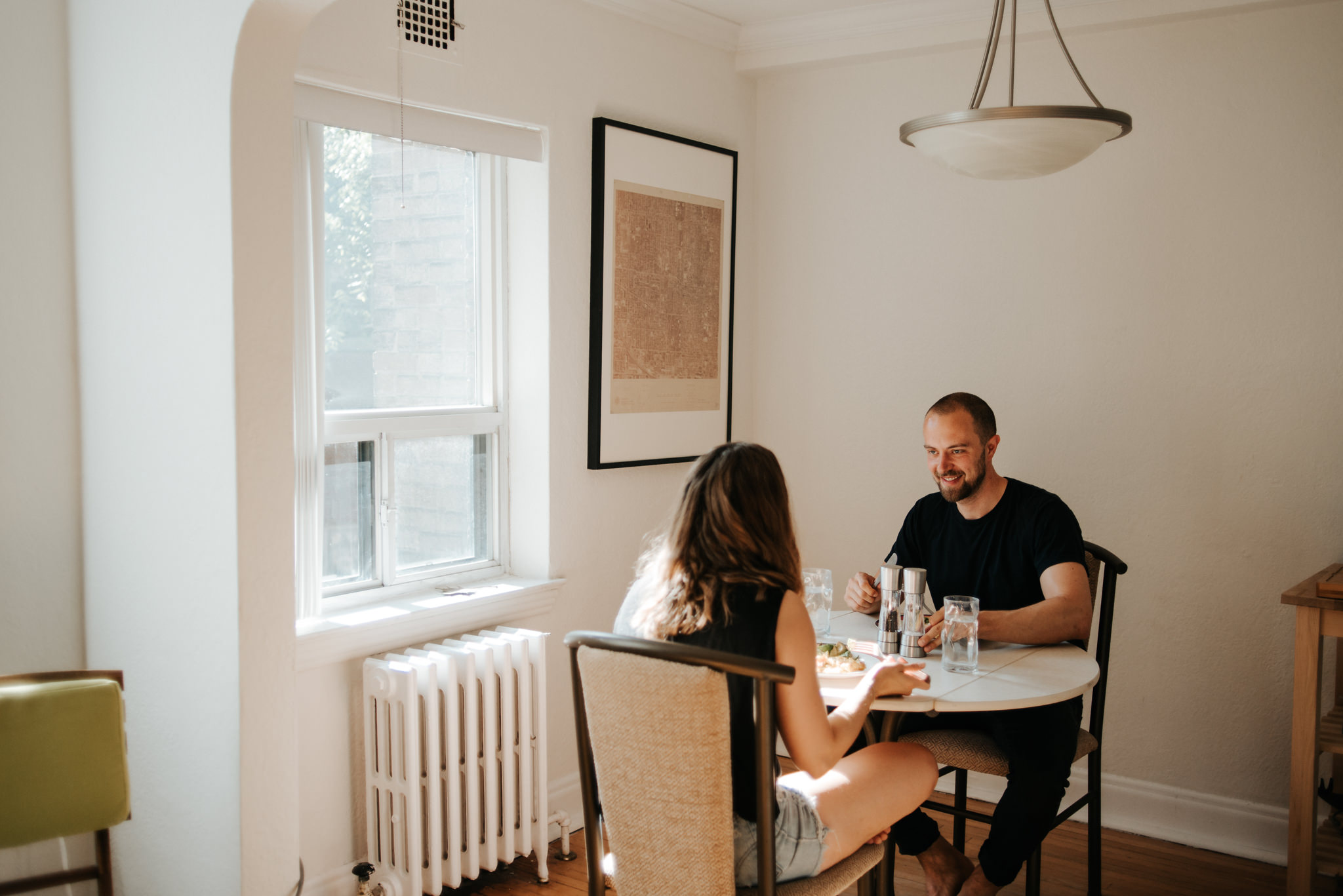 Couple eating breakfast in apartment