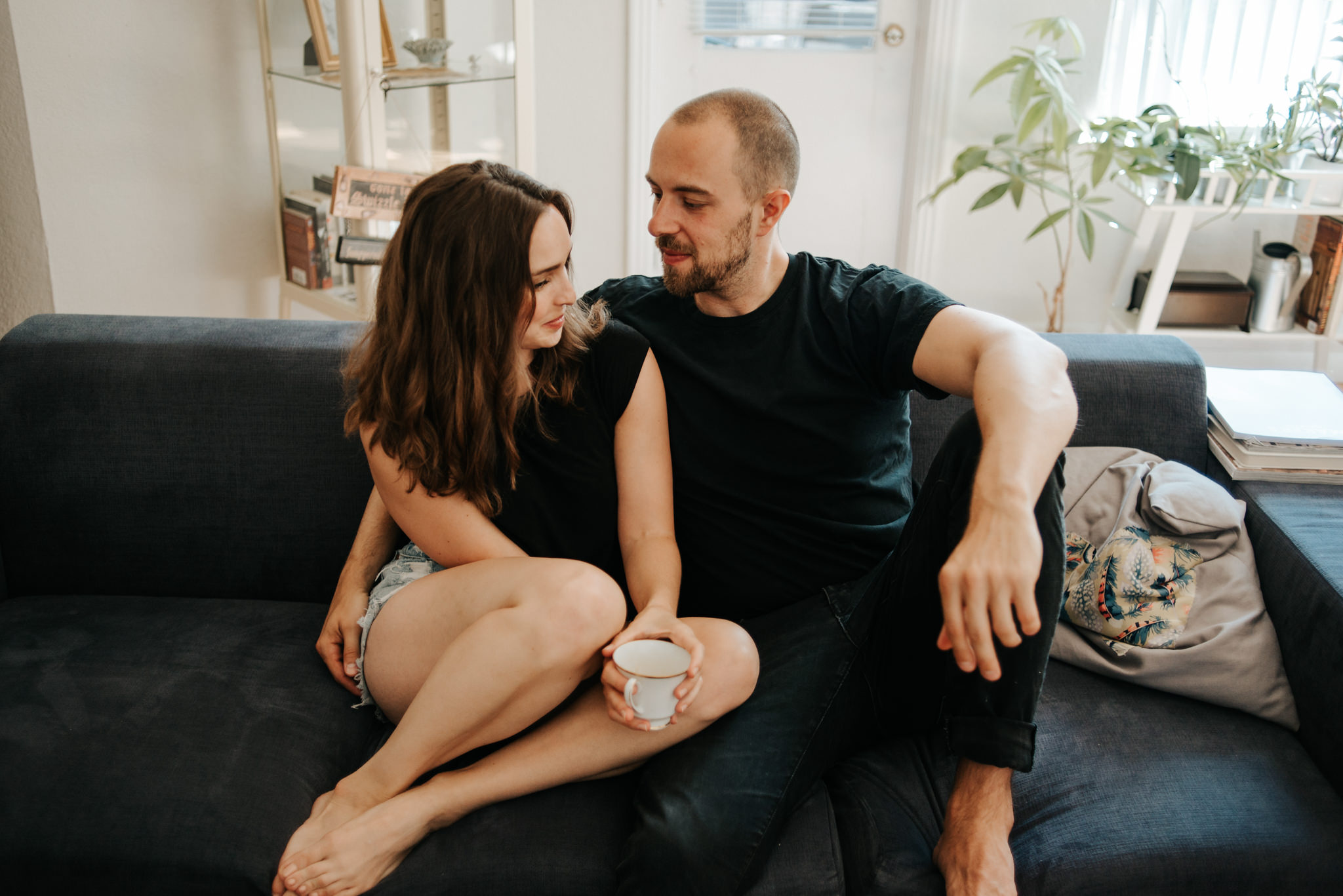 Couple cuddling on couch