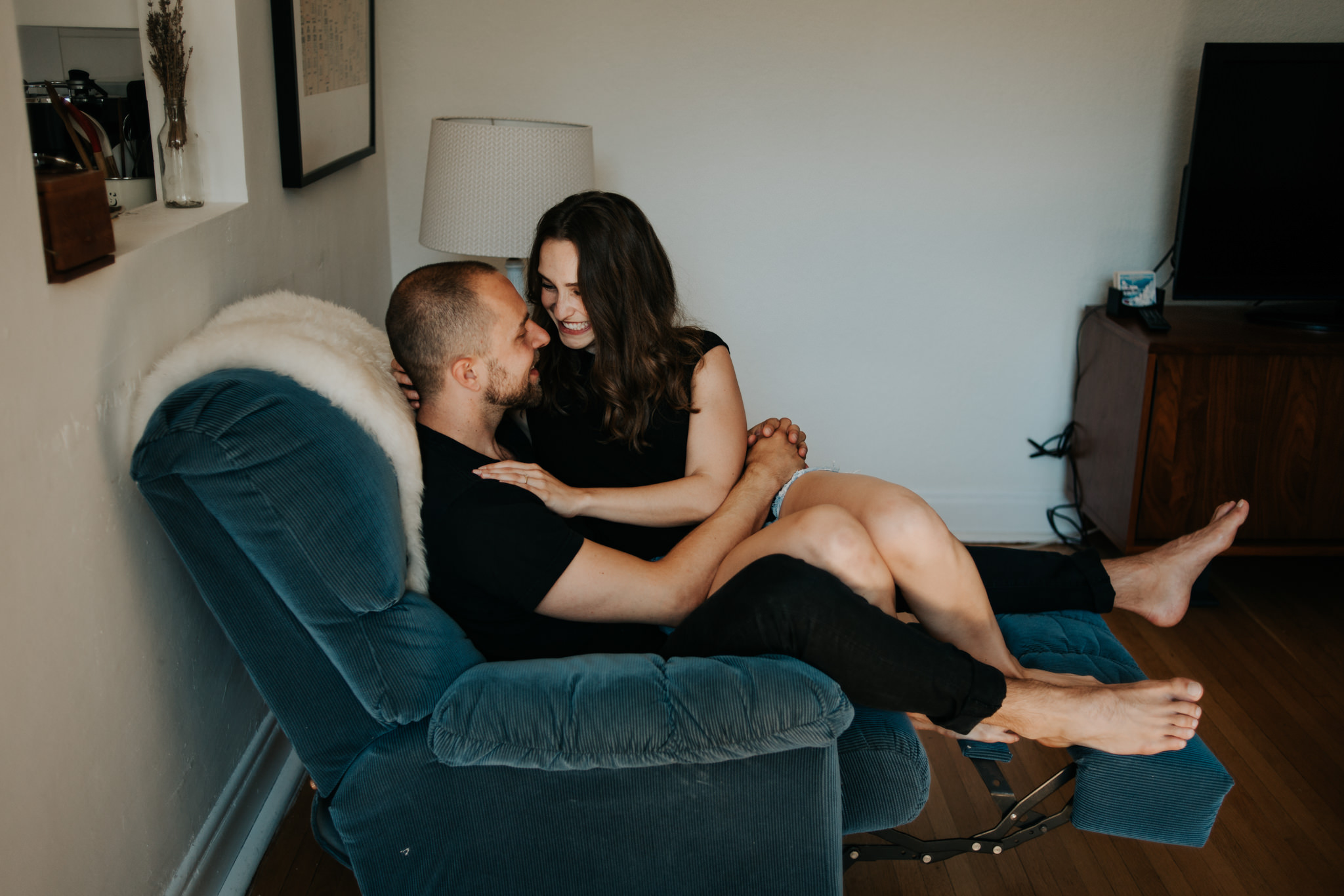 Young couple laughing on chair