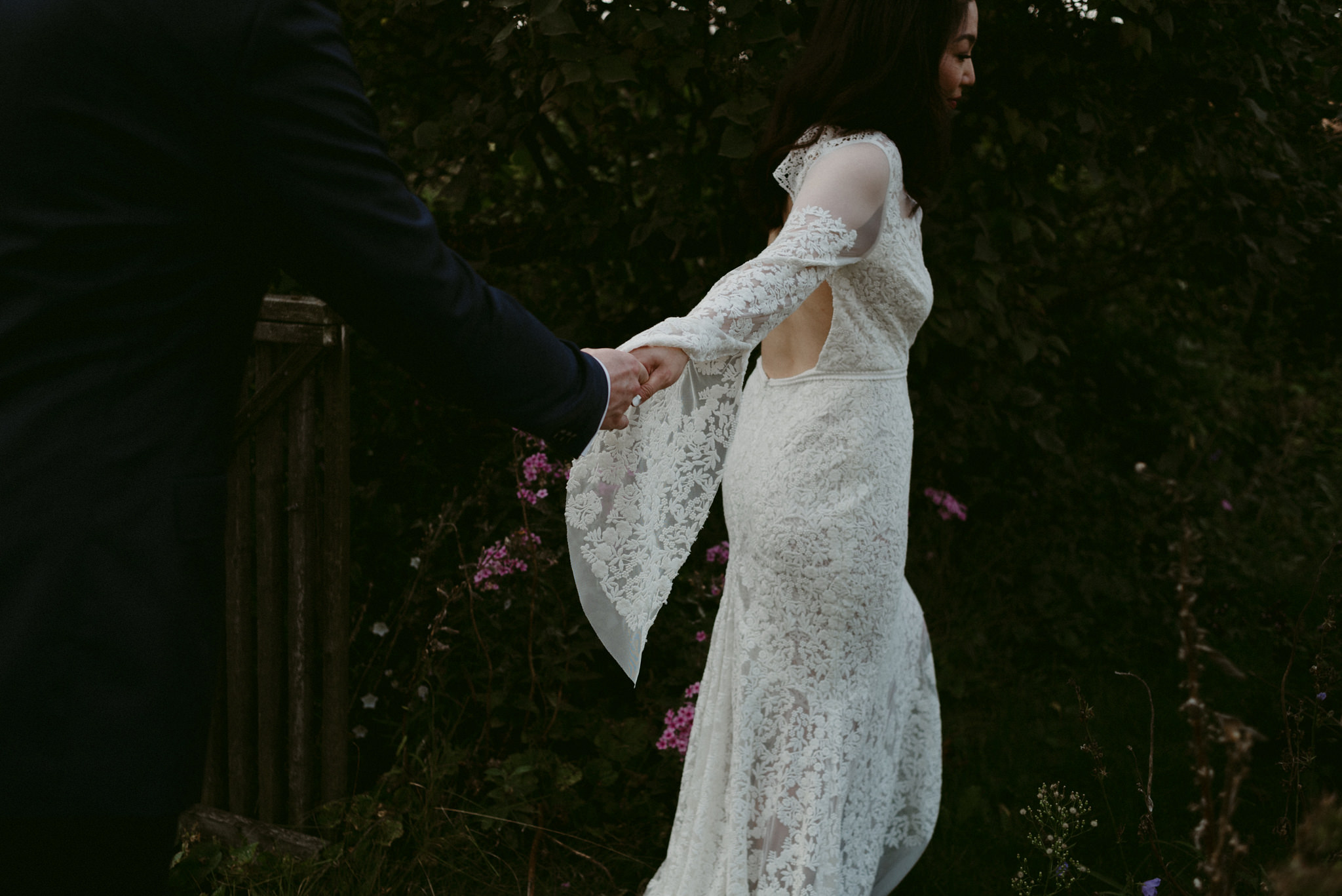 Bride and groom walking holding hands