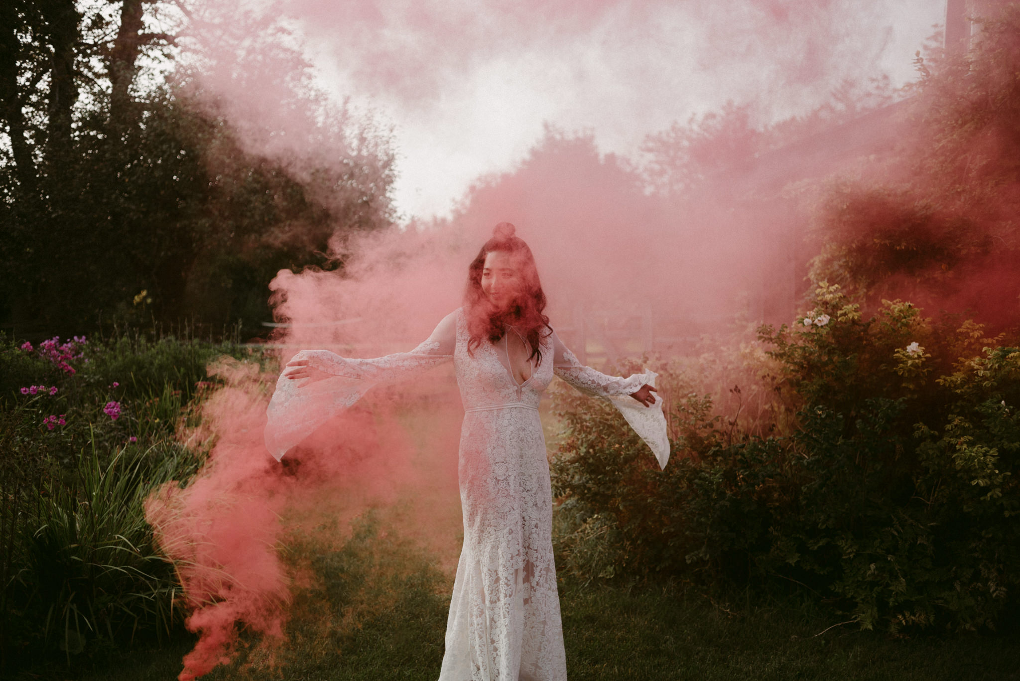 bride dancing in red smoke bomb