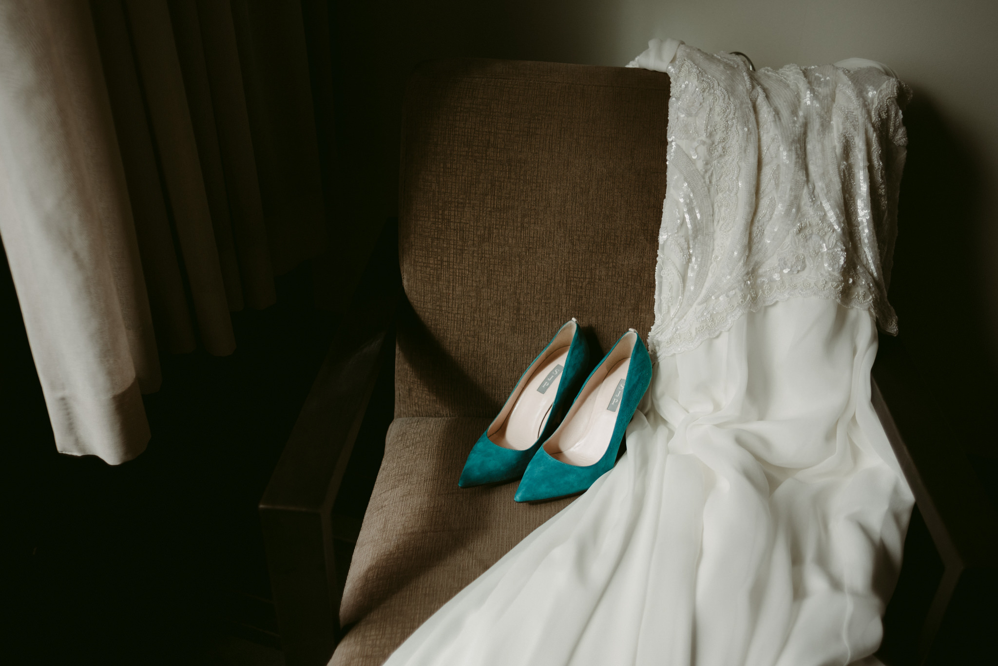 Wedding dress and shoes on chair