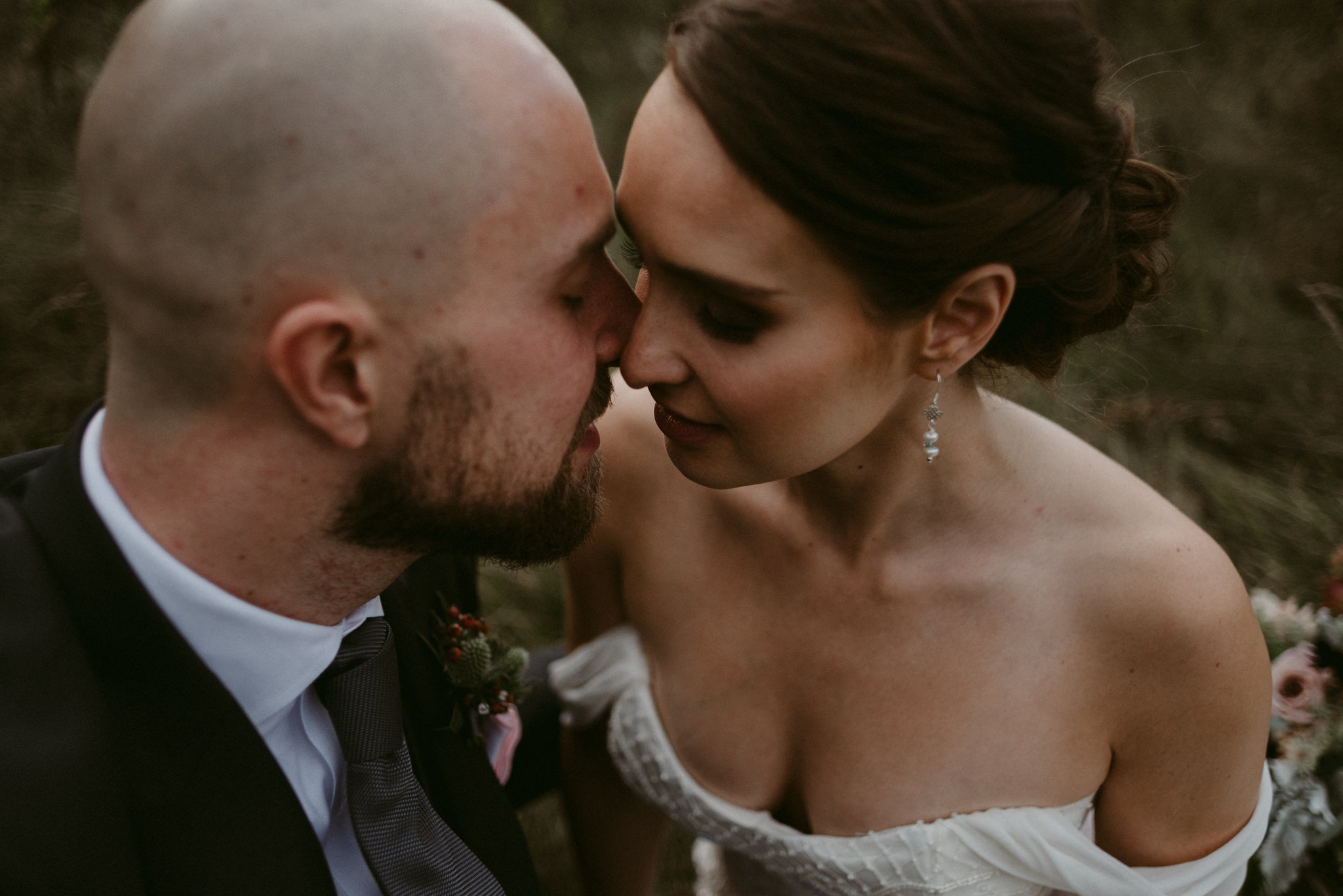 close up of bride and groom kissing