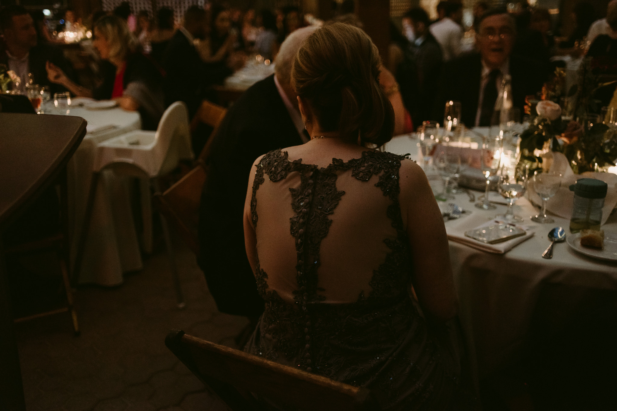 Guests at wedding reception listening to speeches