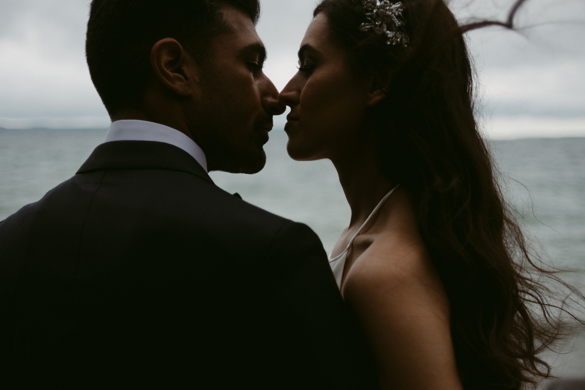 Intimate kiss between bride and groom