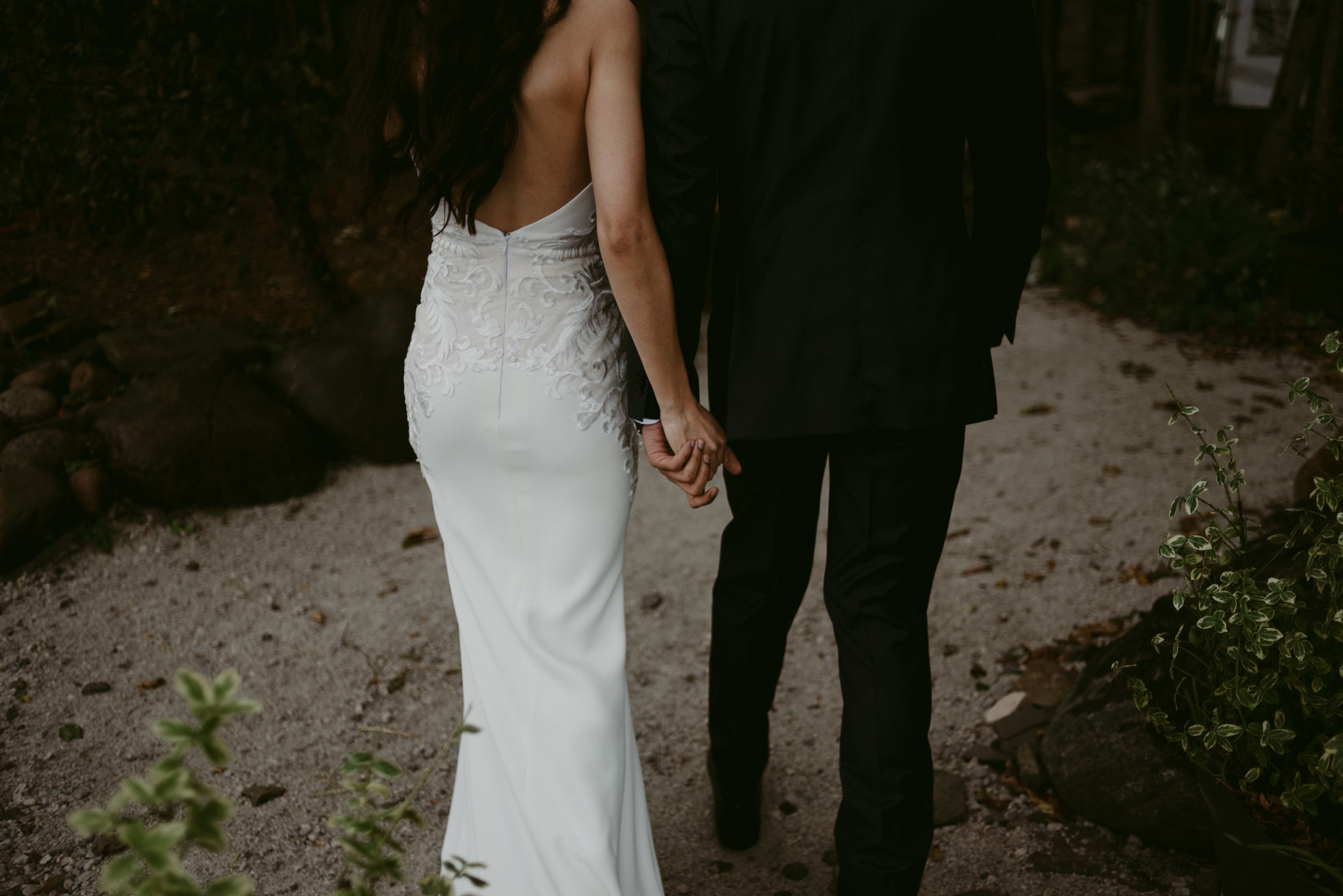 bride and groom holding hands