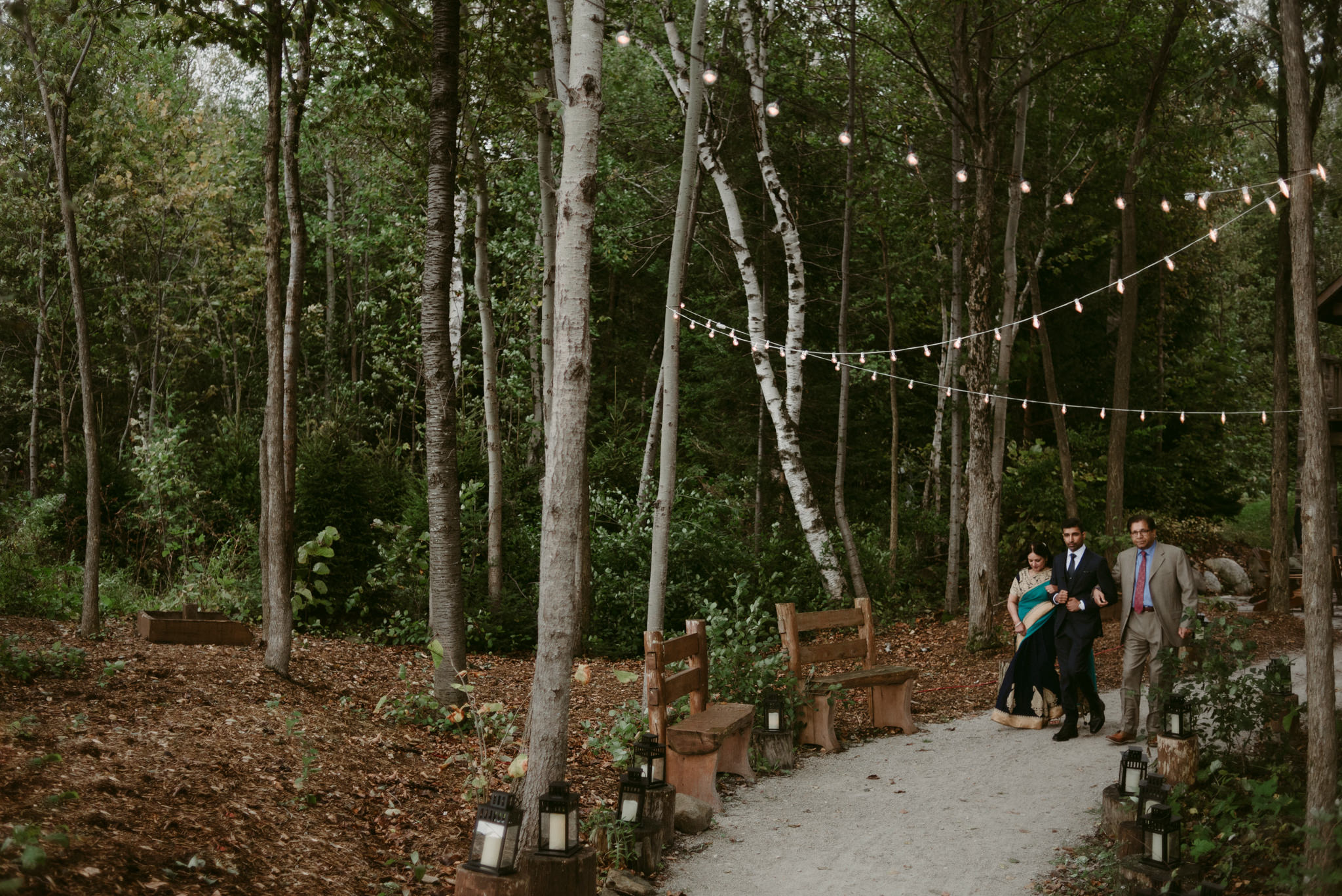 groom walking parents down aisle