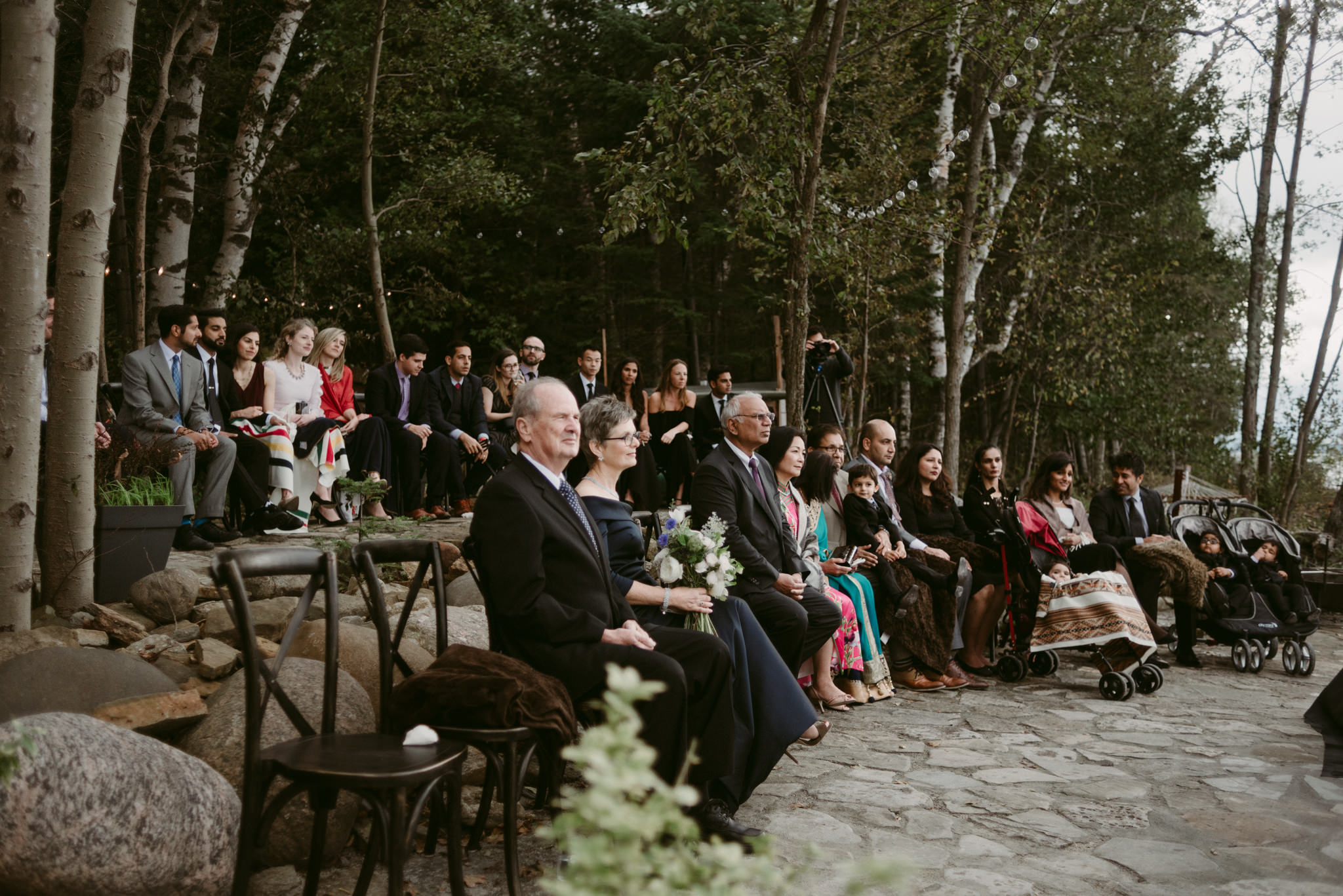 guests sitting outside during wedding ceremony