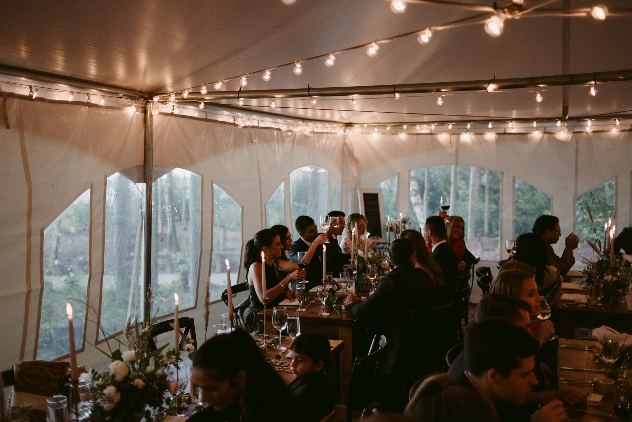 guests inside tent for intimate cottage wedding