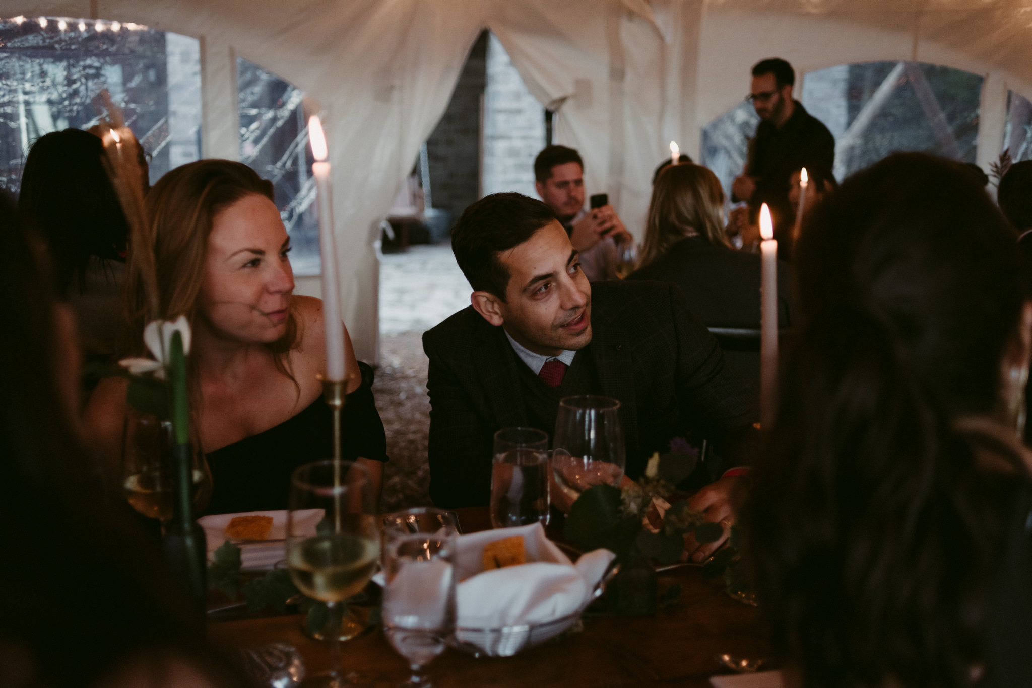 guests inside tent for intimate cottage wedding