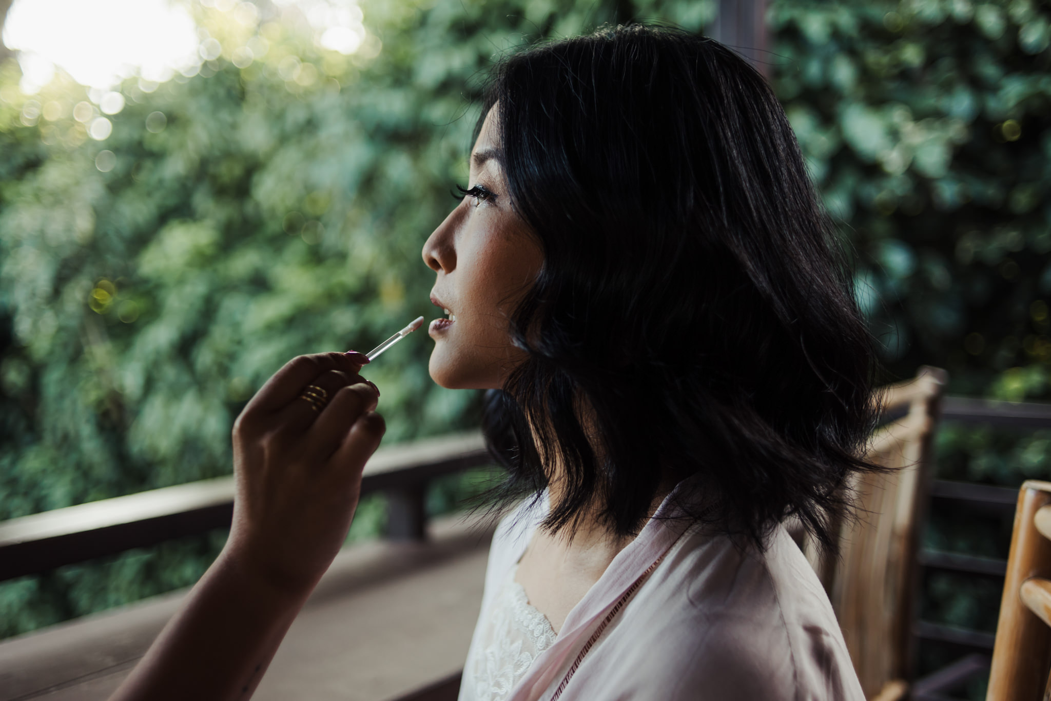 Bride getting lipstick applied