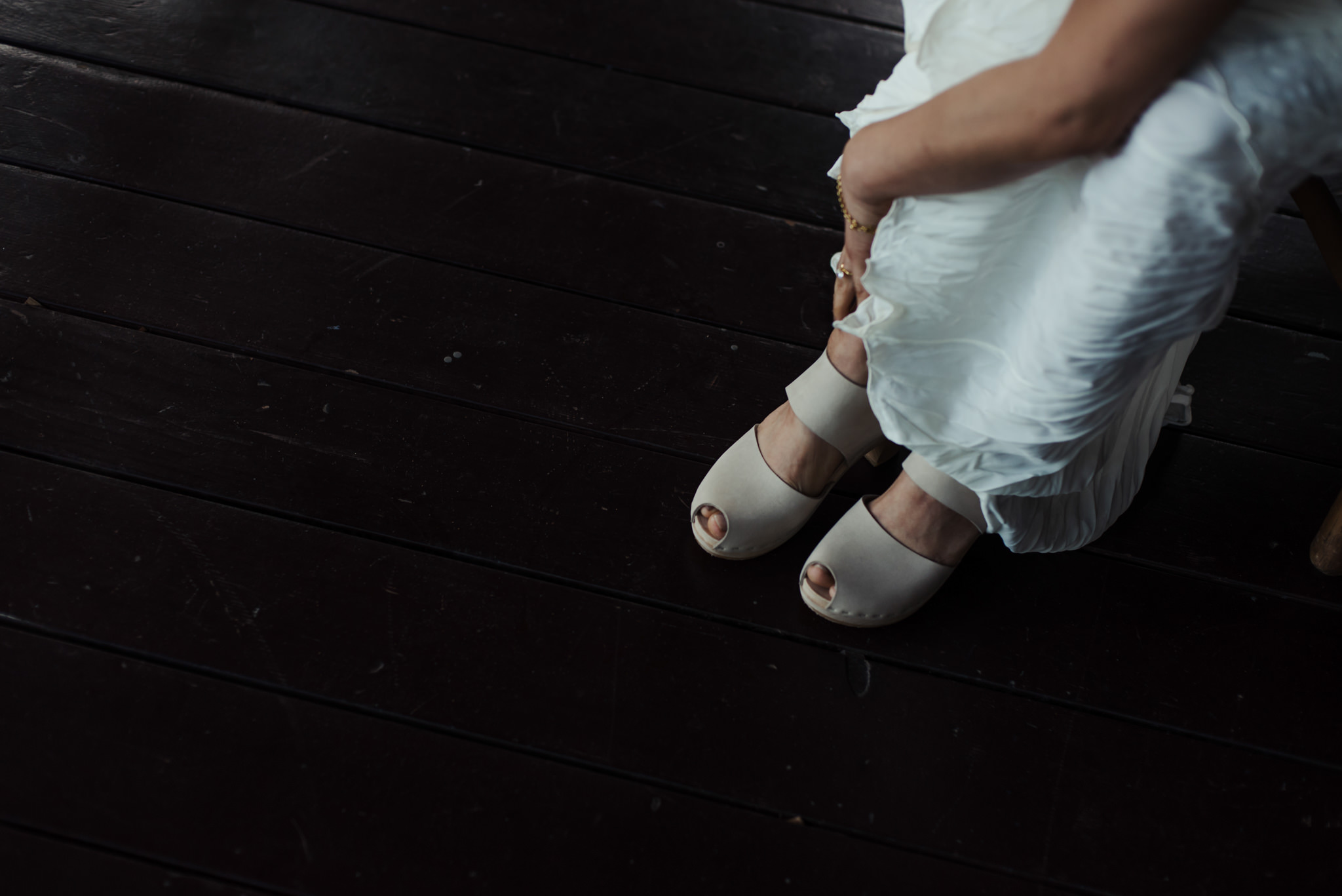 bride buckling up shoes