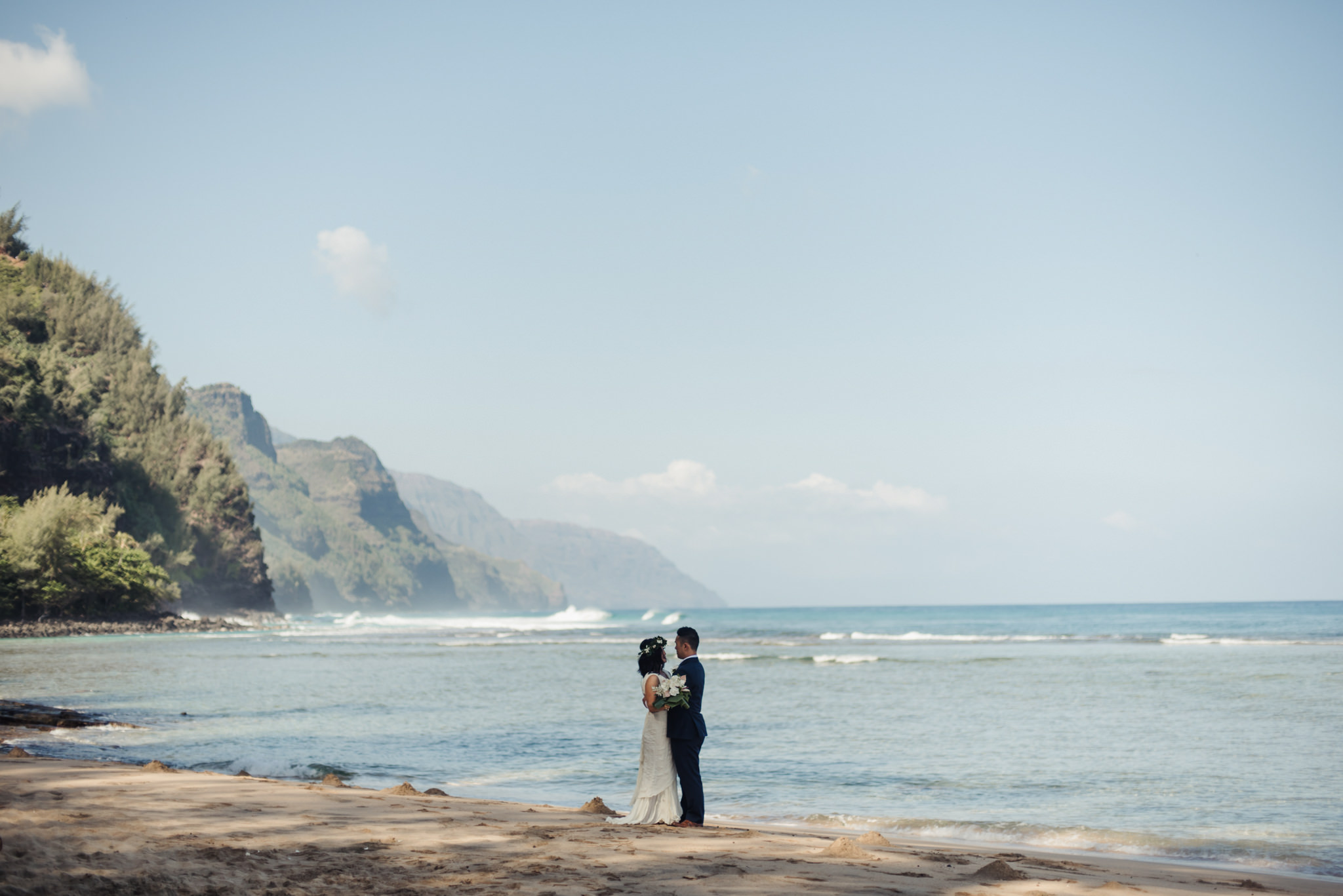 wedding portrait on ke'e beach with na pali coast in background