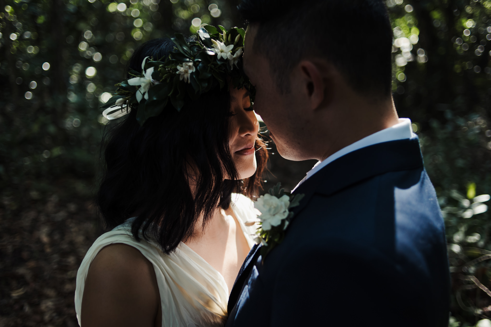 bride and groom walking in tropical forest