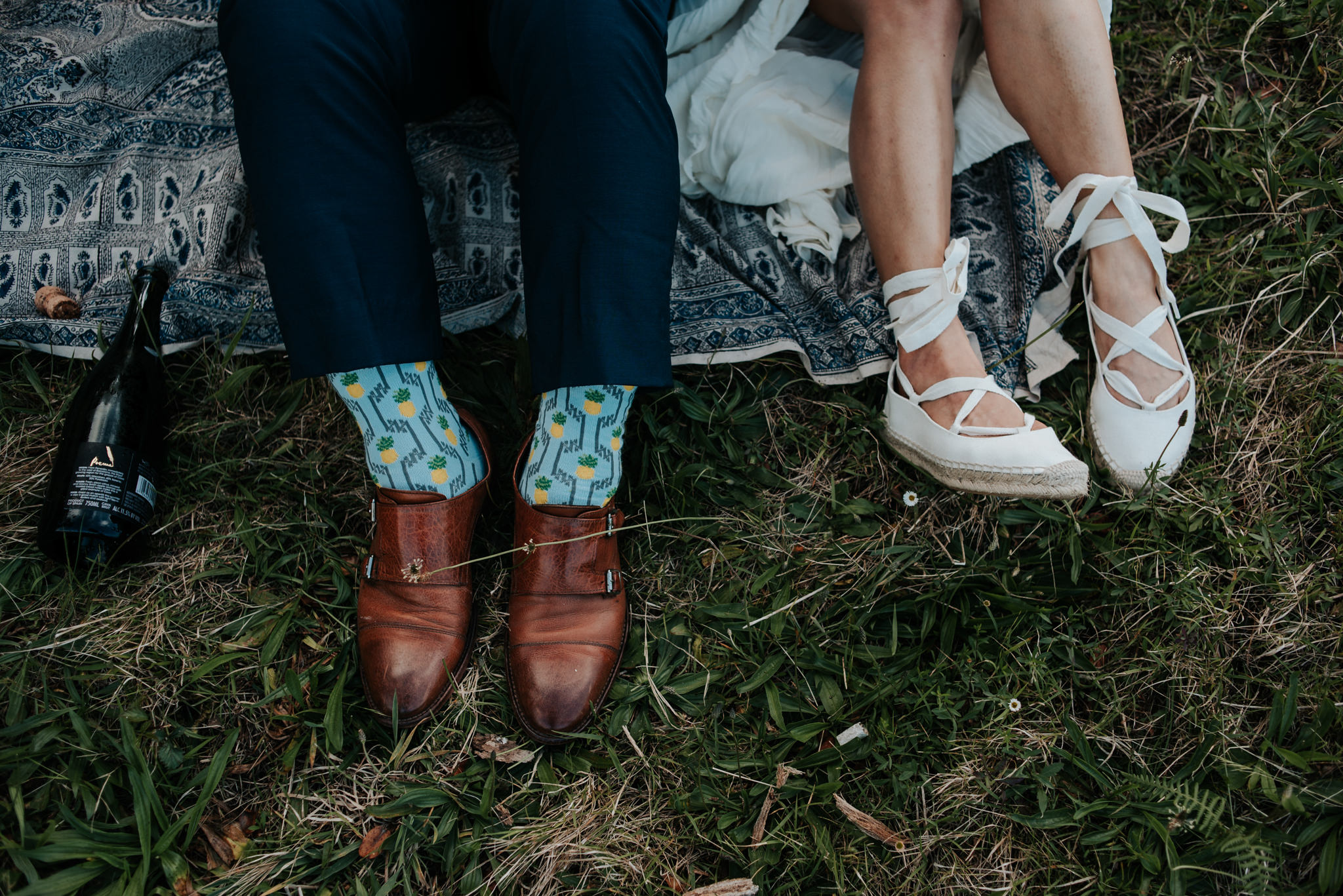 groom wearing pineapple socks