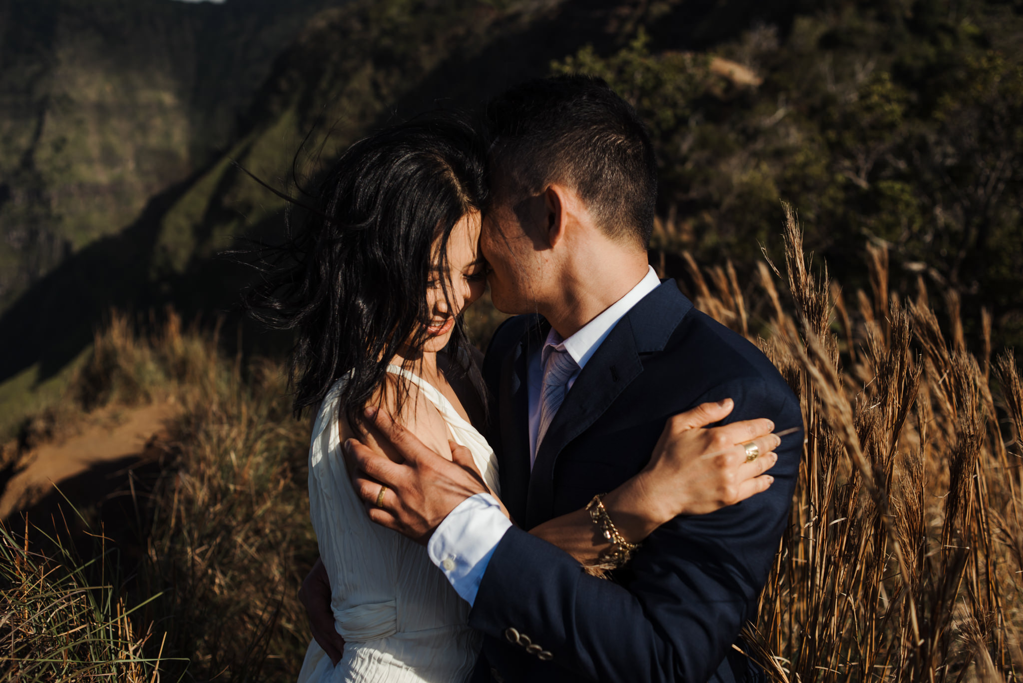 groom hugging bride