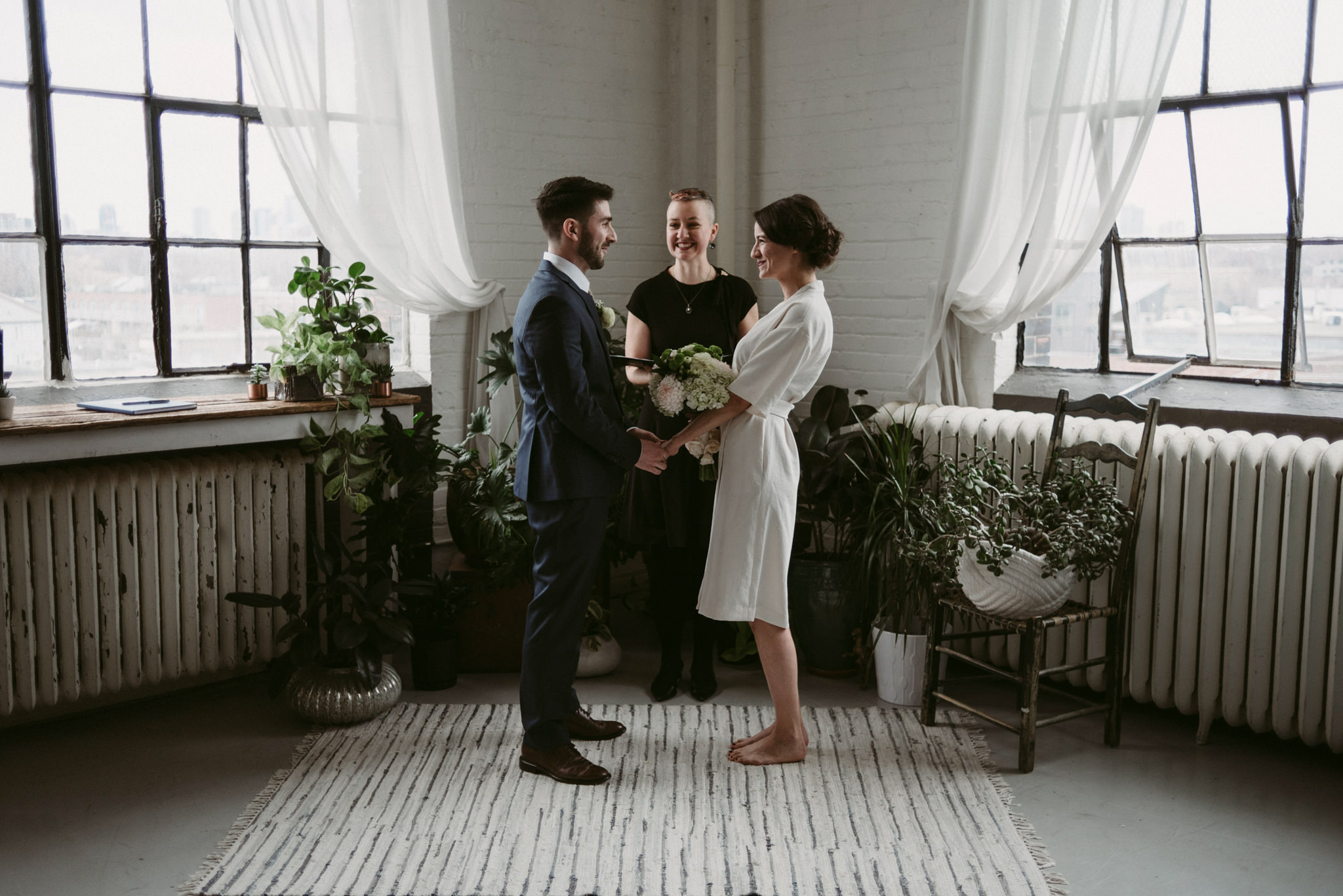 Bride and groom during Toronto loft elopement ceremony