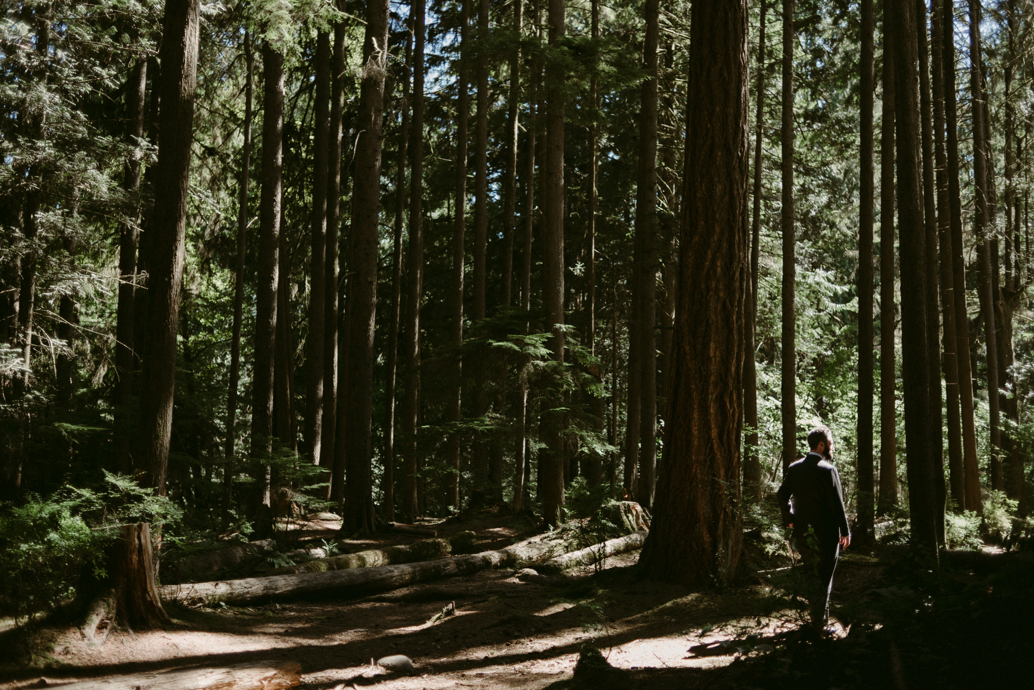 groom waiting in forest for bride