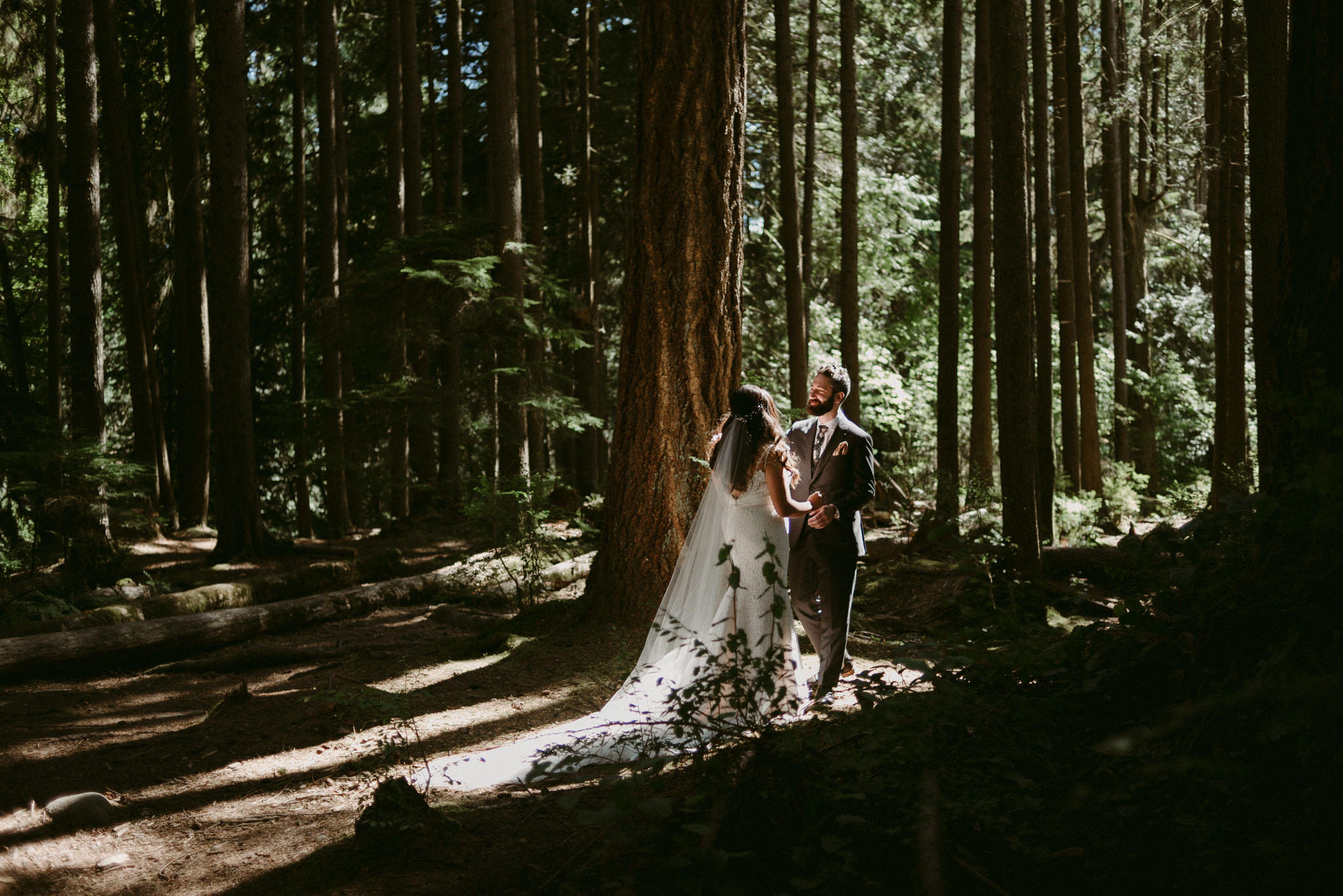 bride and groom first look in forest