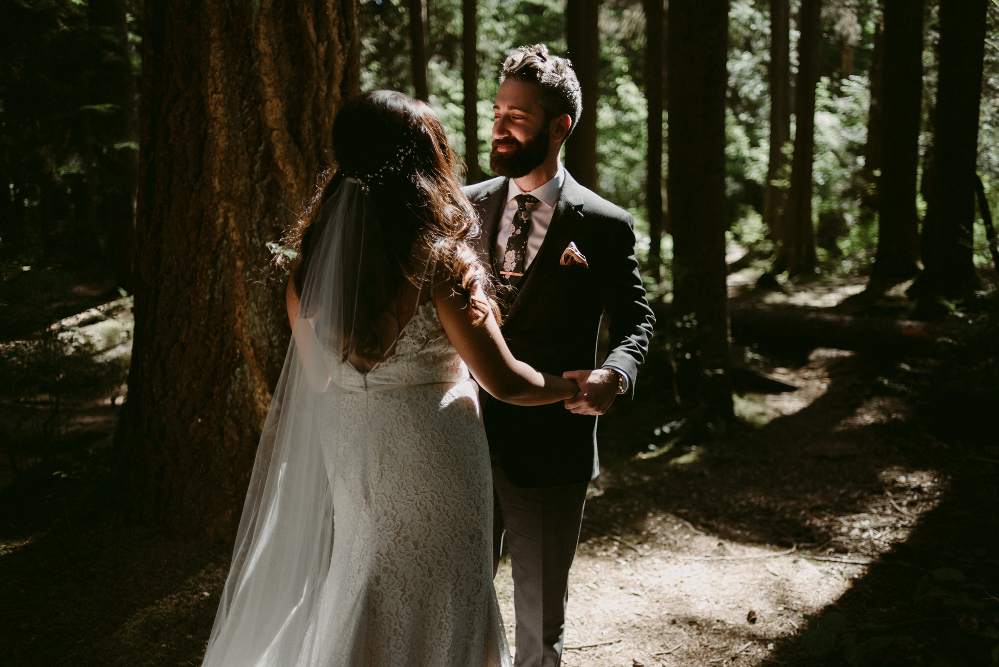 bride and groom first look in fores