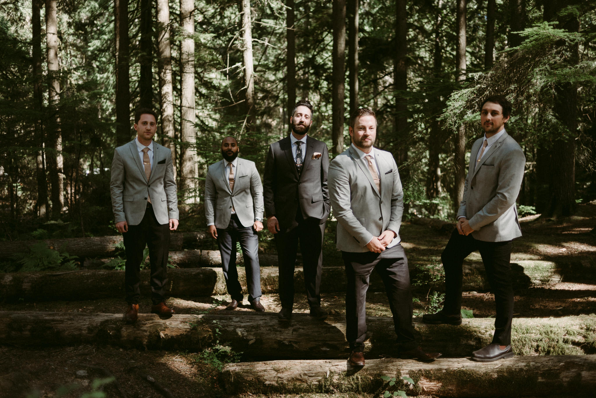 groom and groomsmen in forest