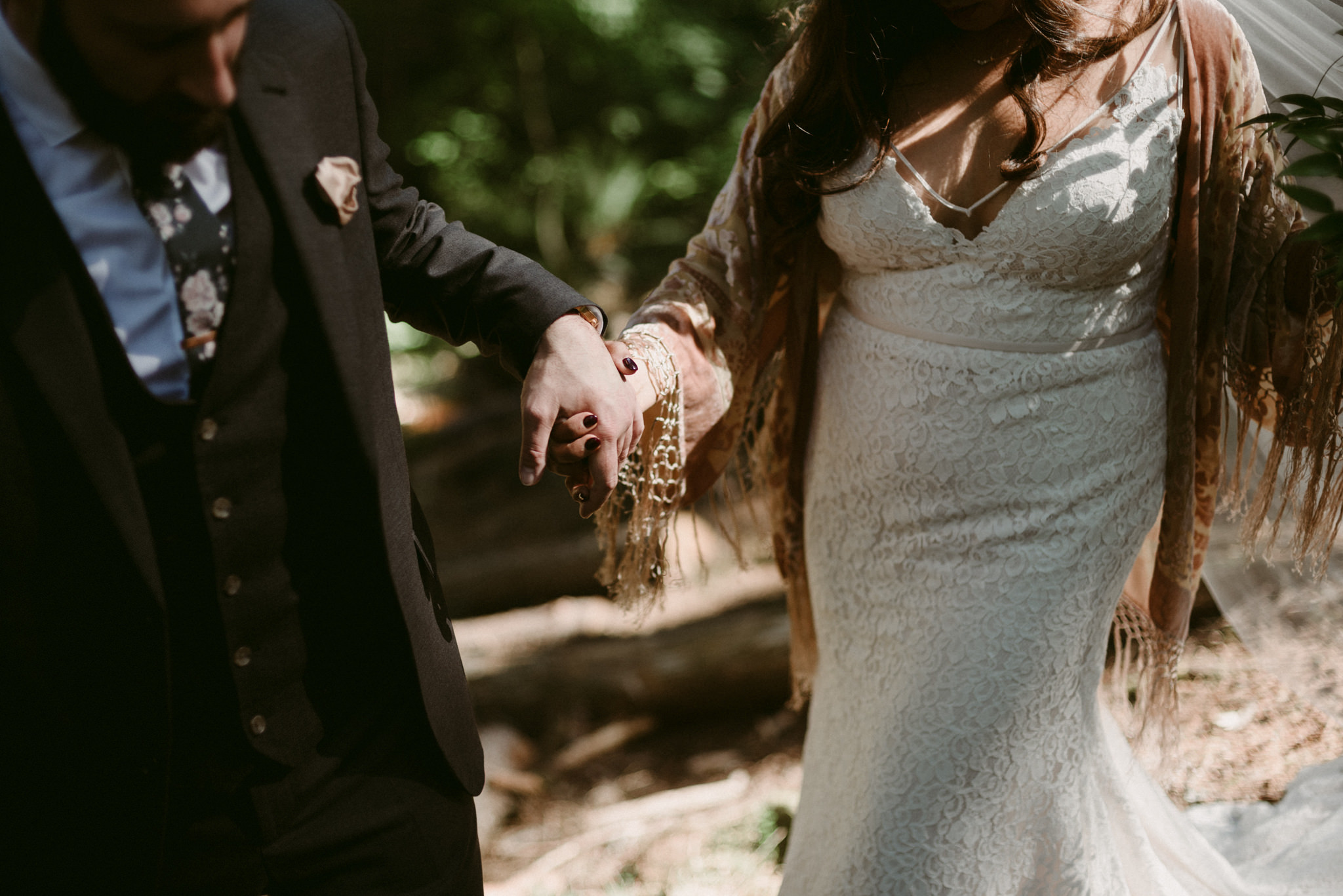 bride and groom holing hands