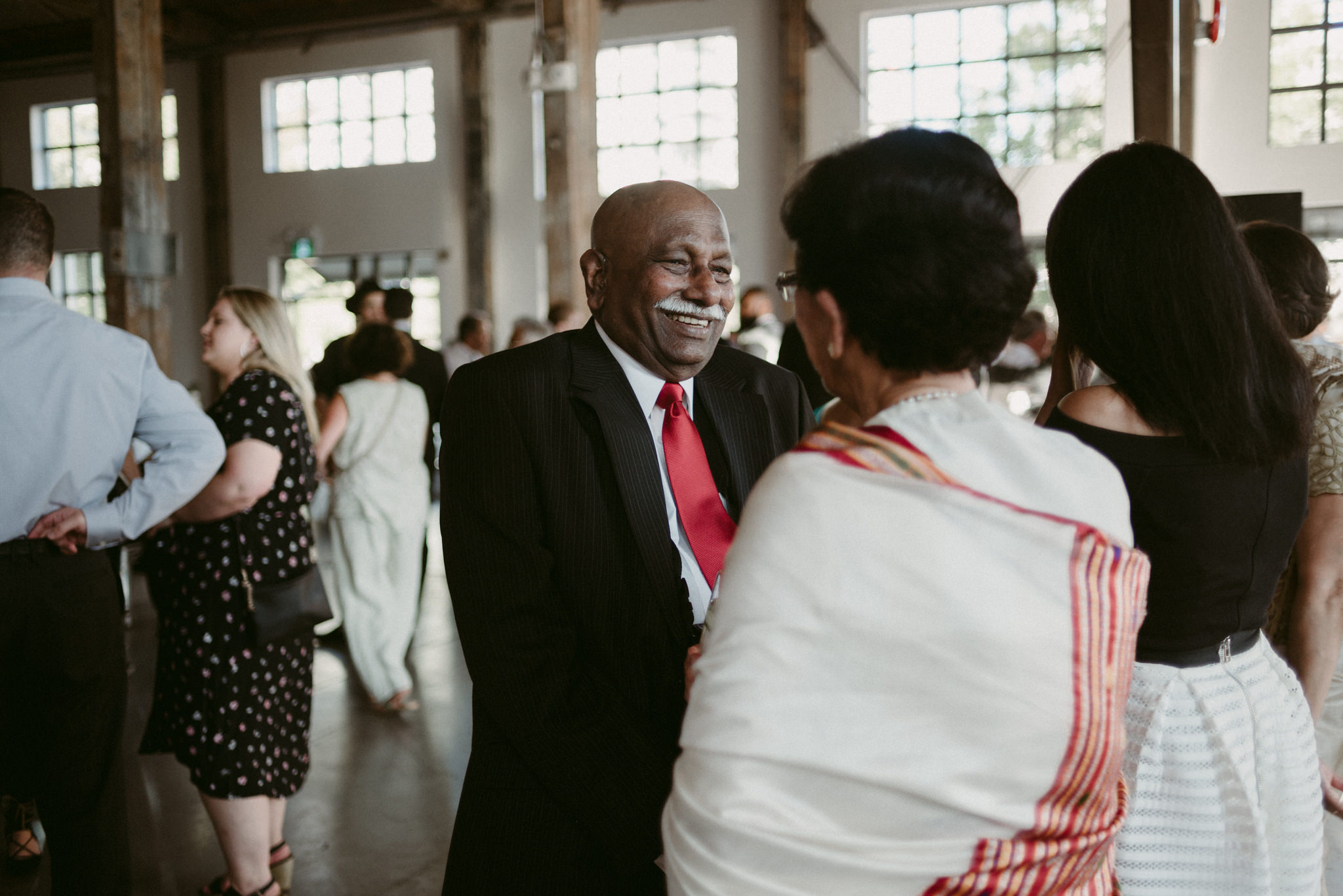 guests smiling during wedding reception