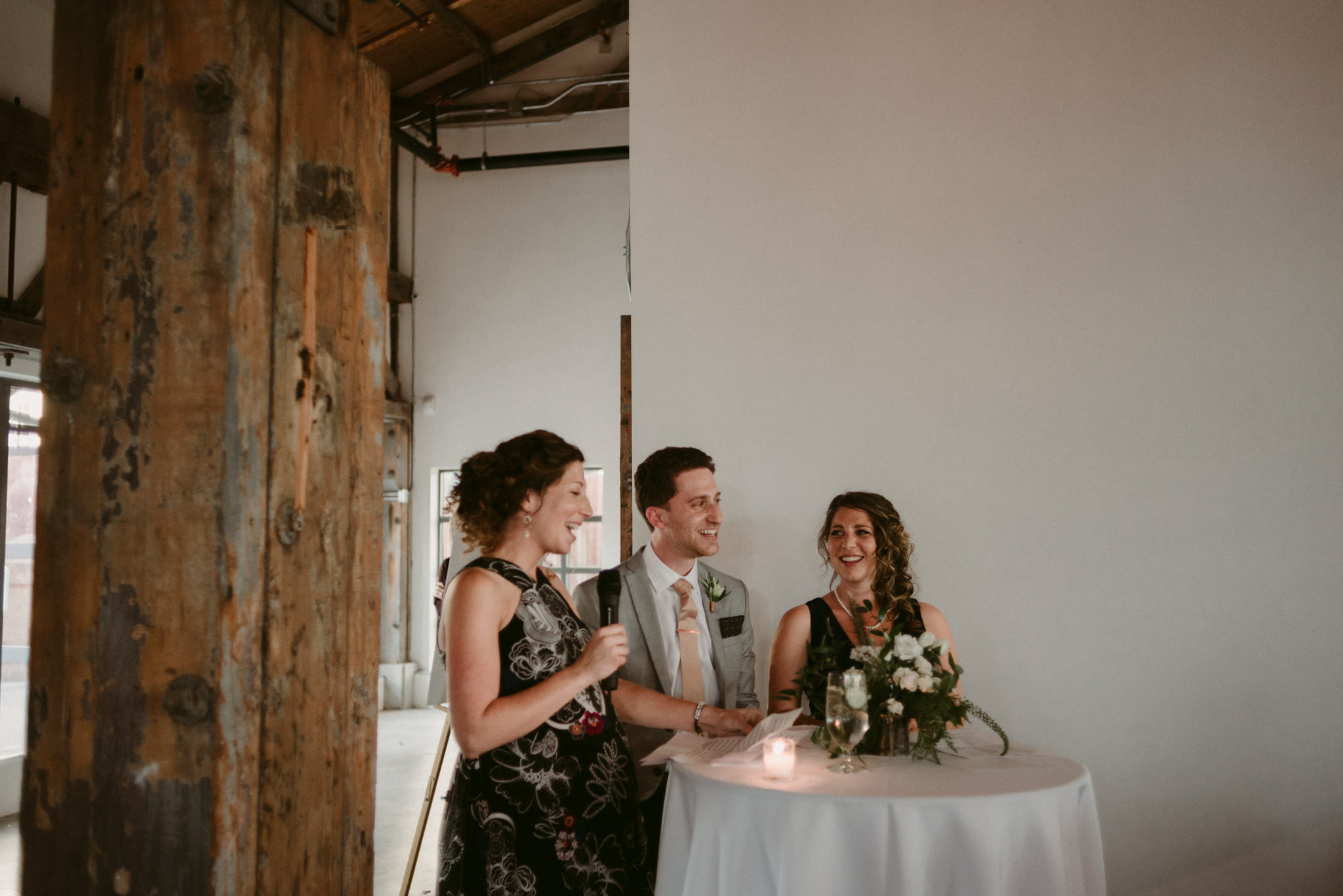 guests giving speech at wedding