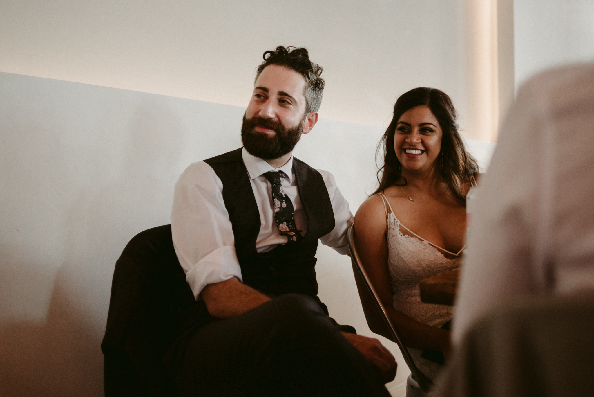 bride and groom smiling during wedding reception