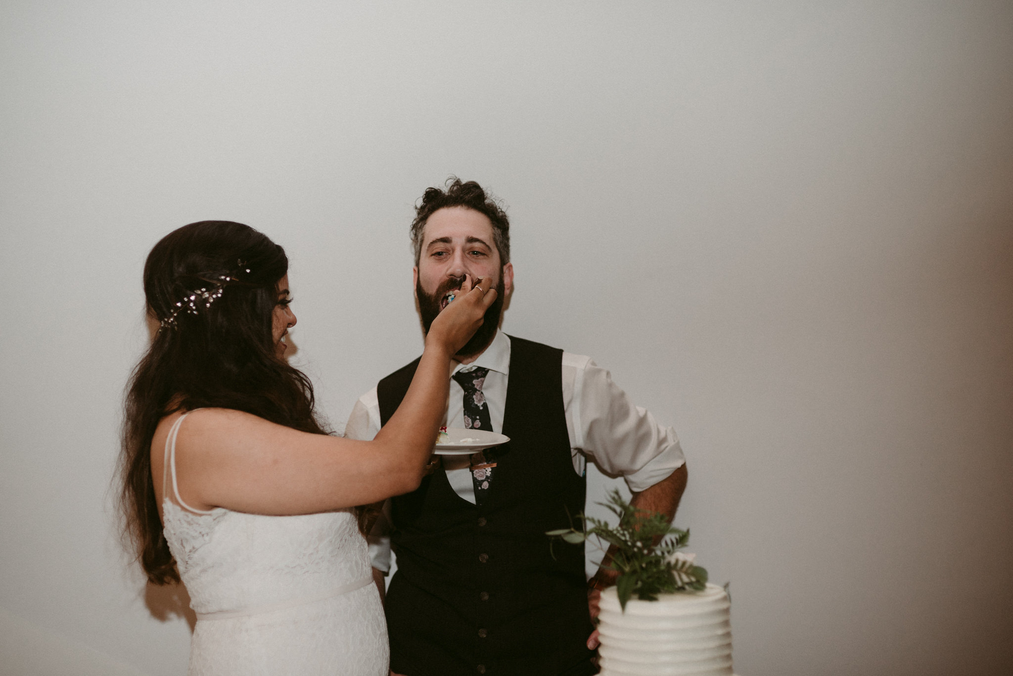 bride and groom eating cake