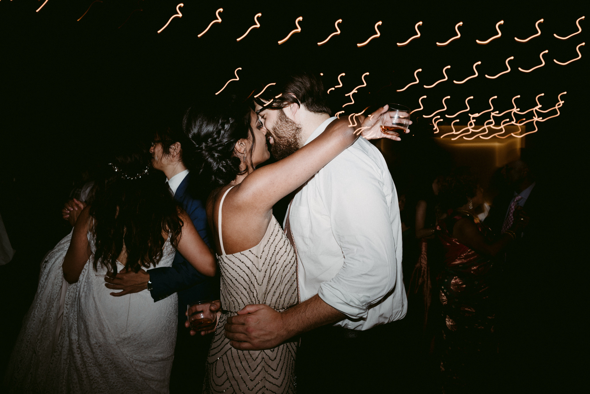 guests kissing on dance floor