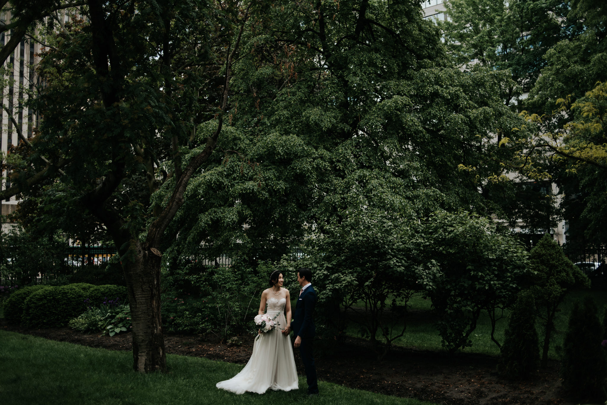 groom whispering in brides ear