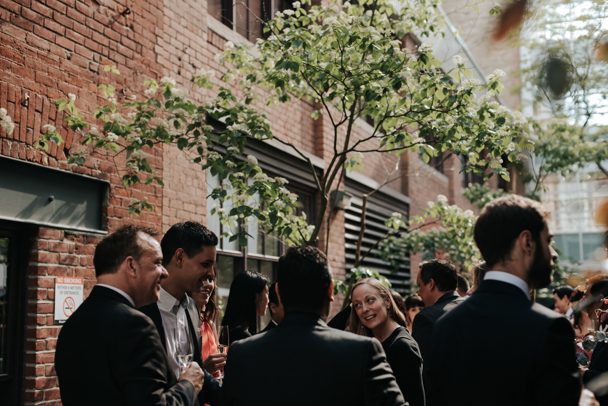 waiter passing hors d'oeuvres during cocktail hour at wedding