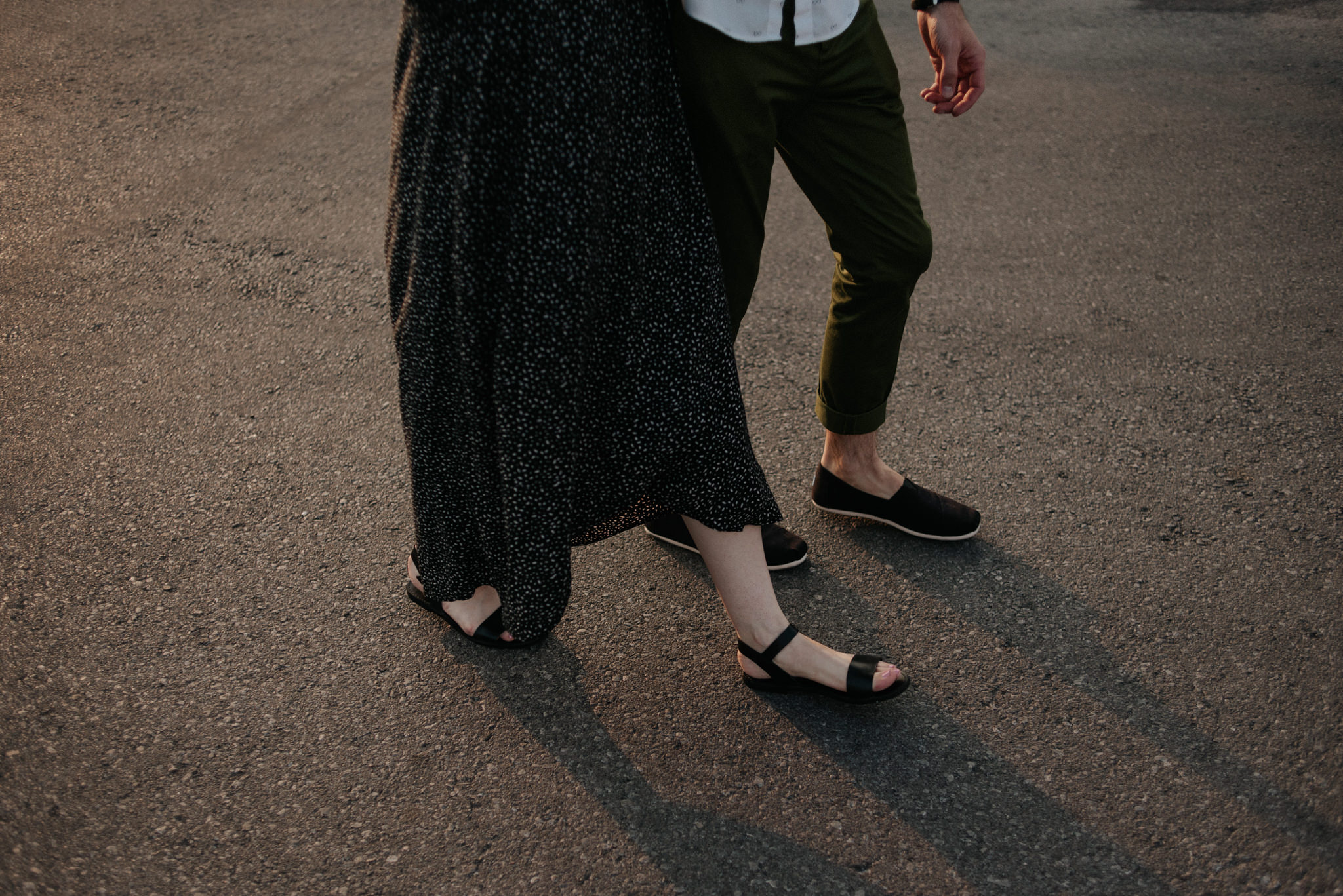 Couple walking on rooftop in Toronto at sunset