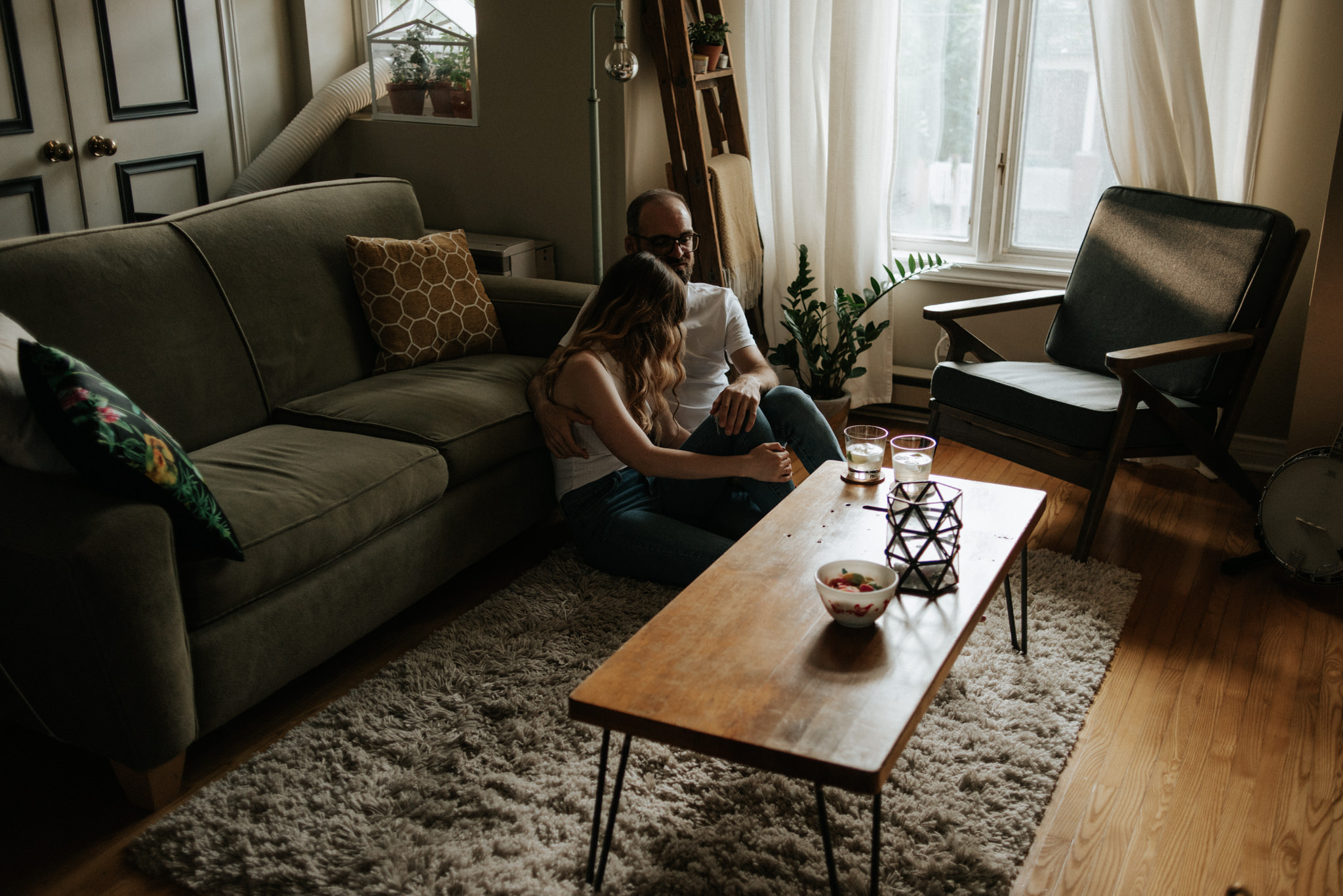 Couple sitting on apartment floor