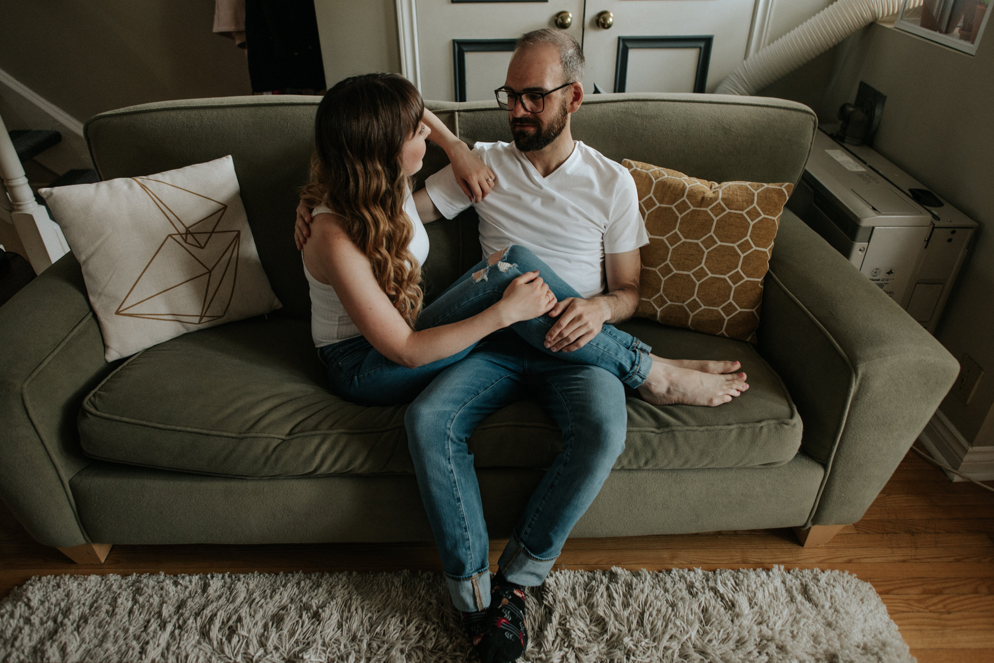 Couple sitting on couch in apartment