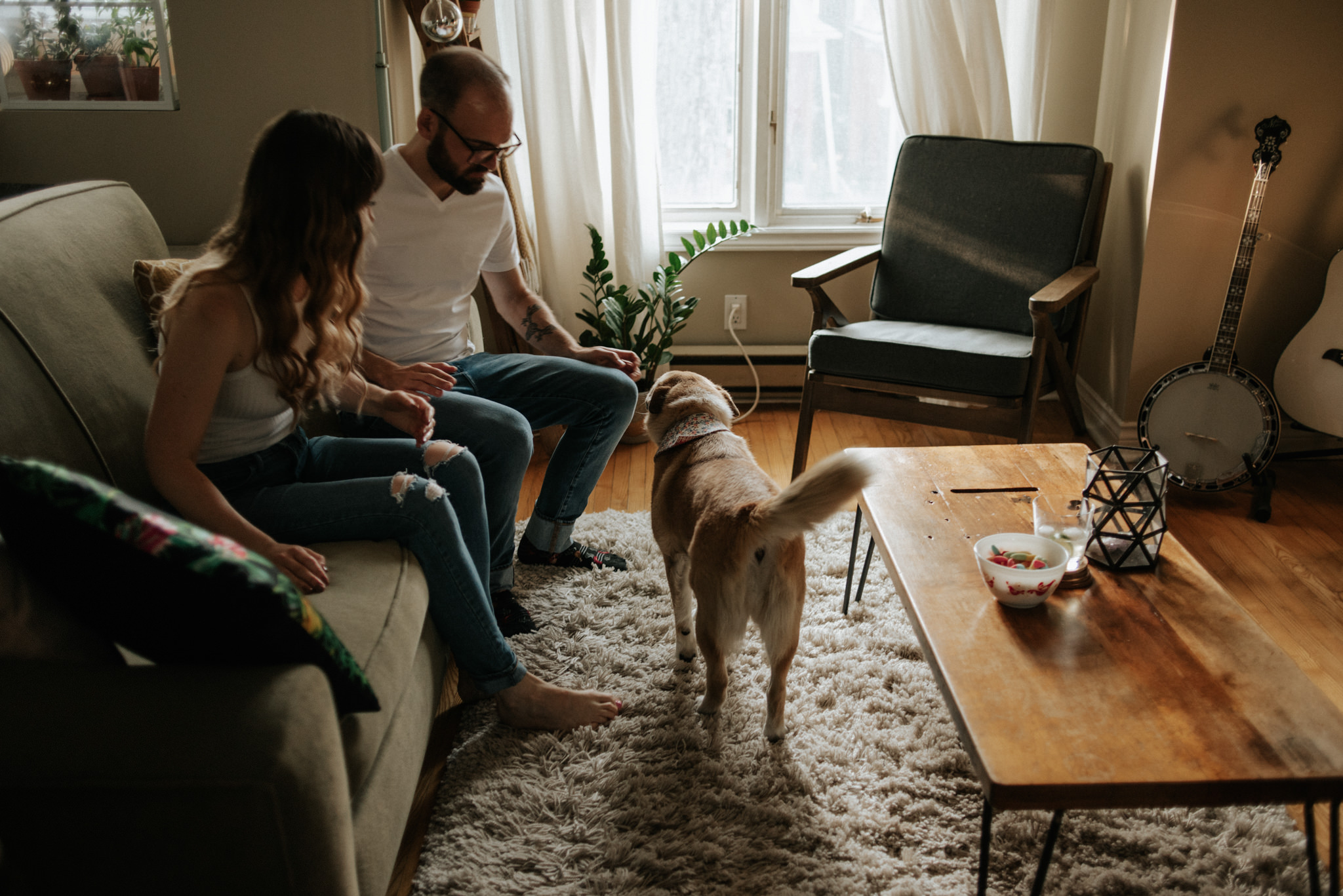 Couple with their dog in their apartment in Toronto