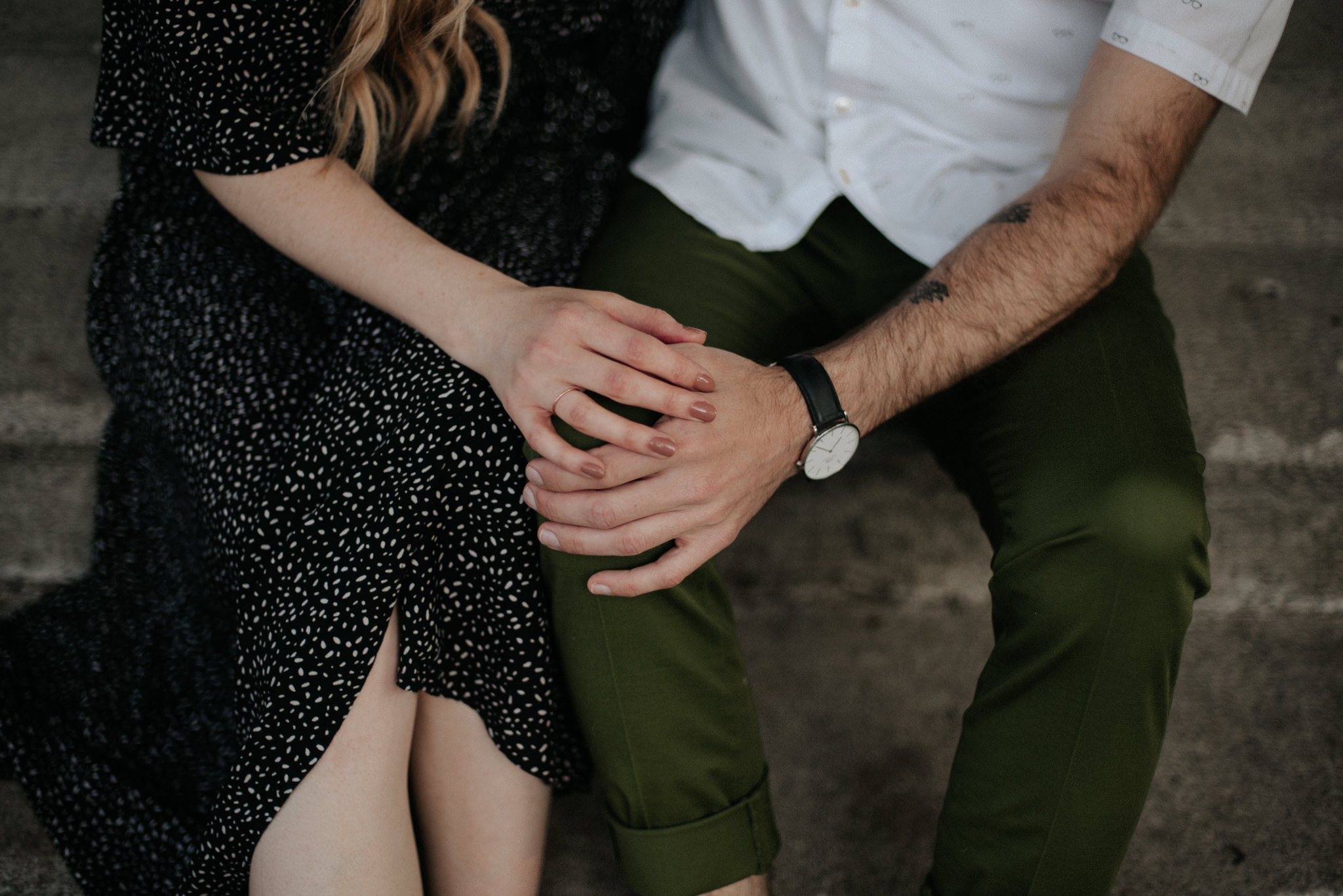 Couching sitting on steps holding hands