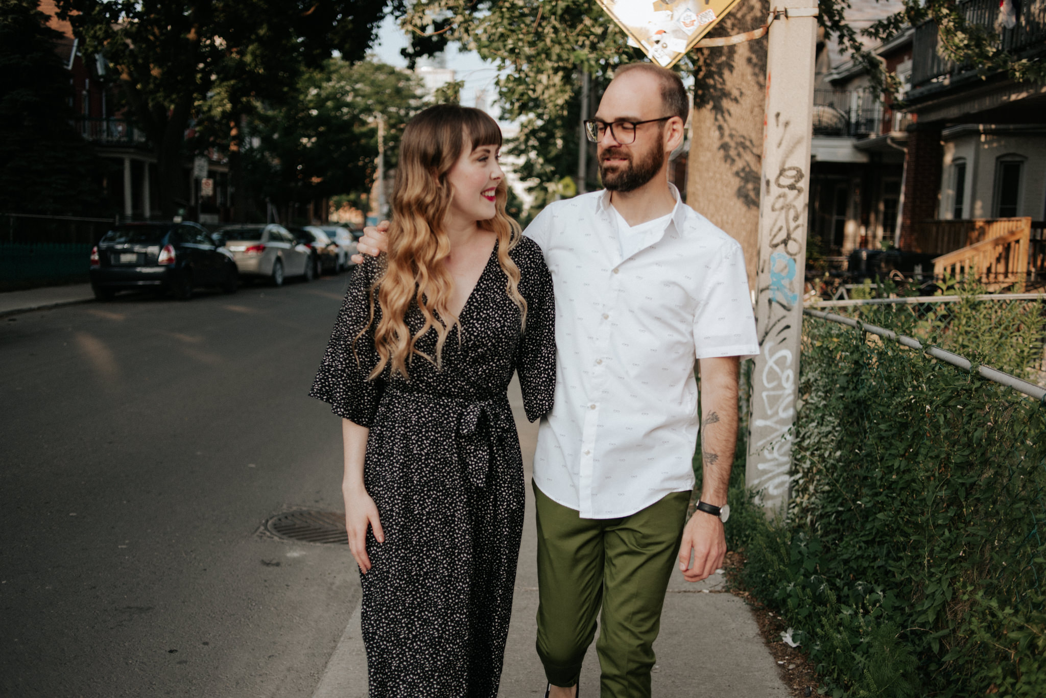 Couple walking on residential street in Toronto