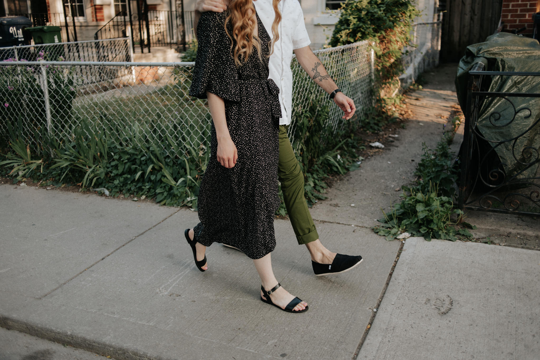 Couple walking on residential street in Toronto