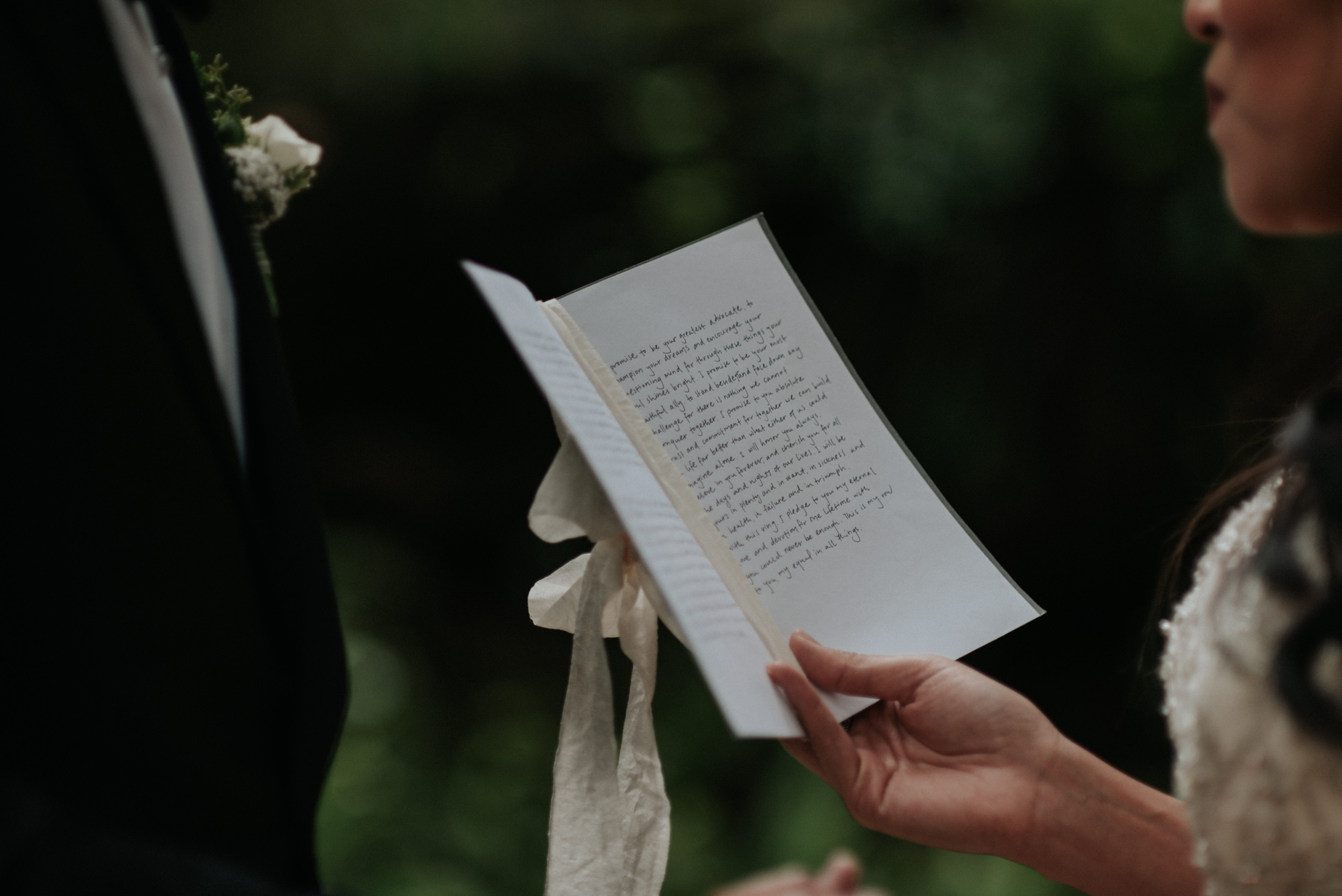 couple reading vows to each other