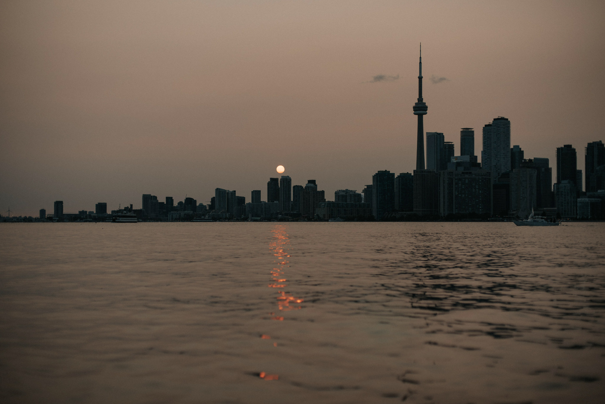 Couple in water at sunset