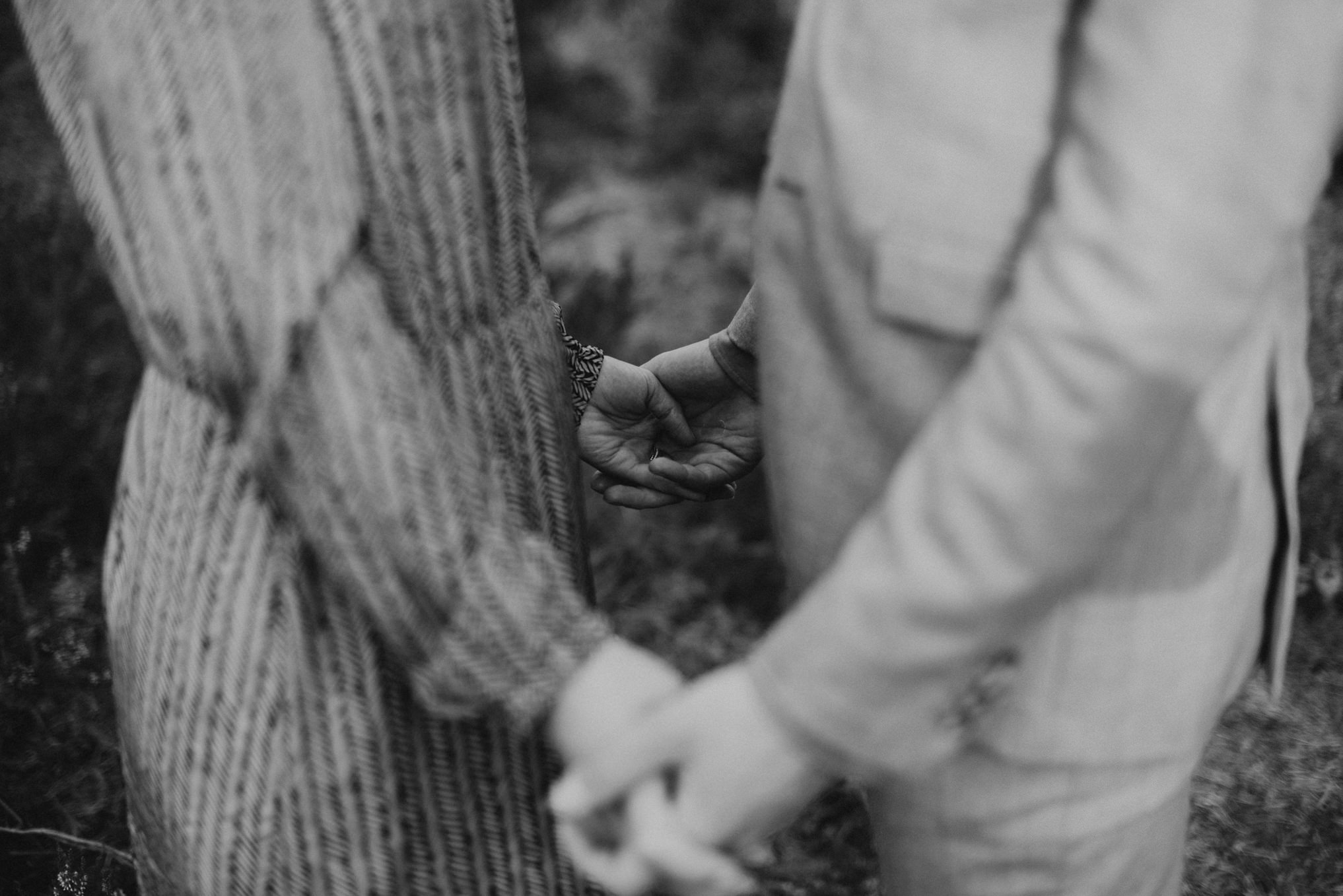 black and white images of close-up of couple holding hands