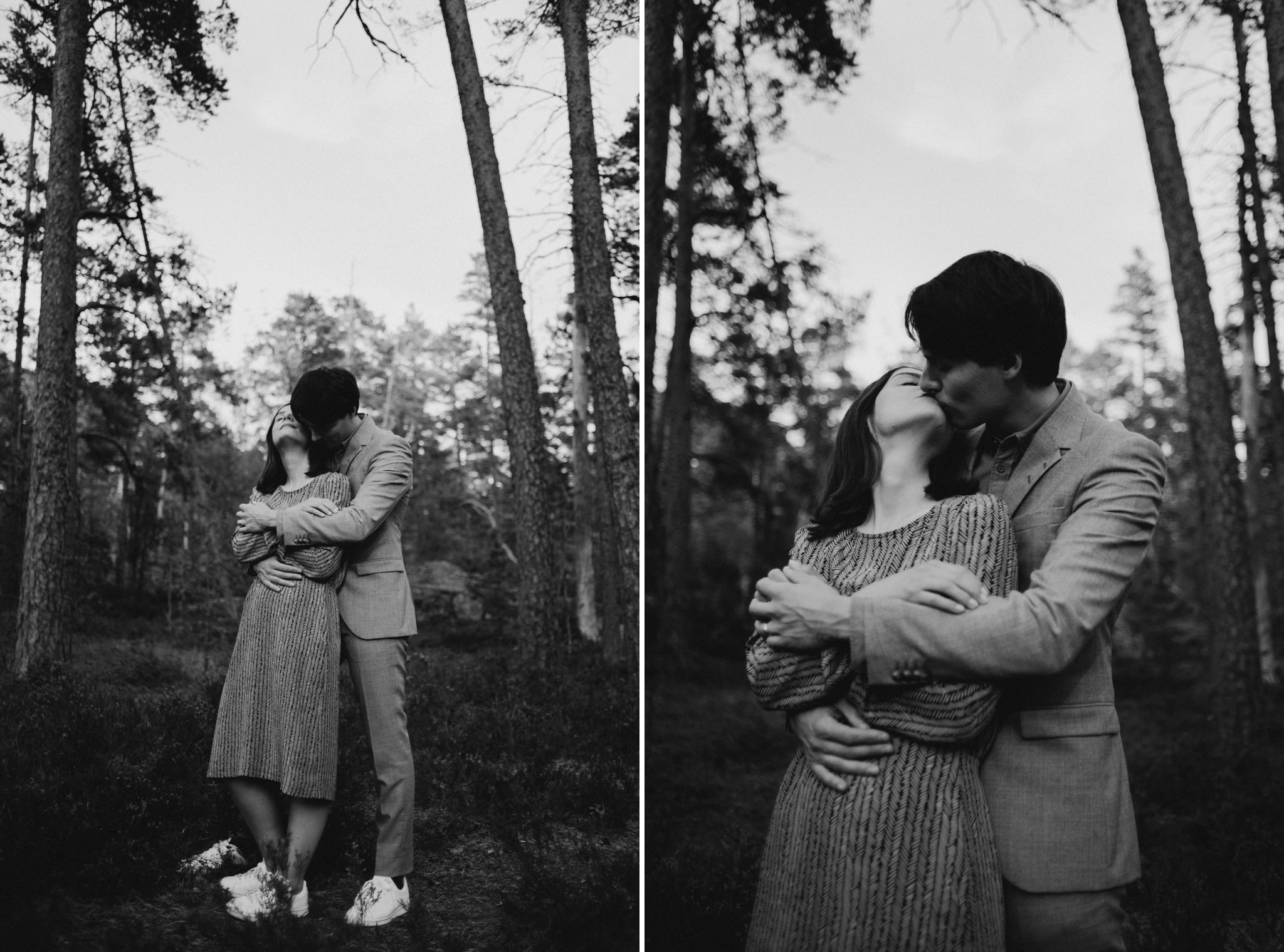 black and white image of couple hugging in forest