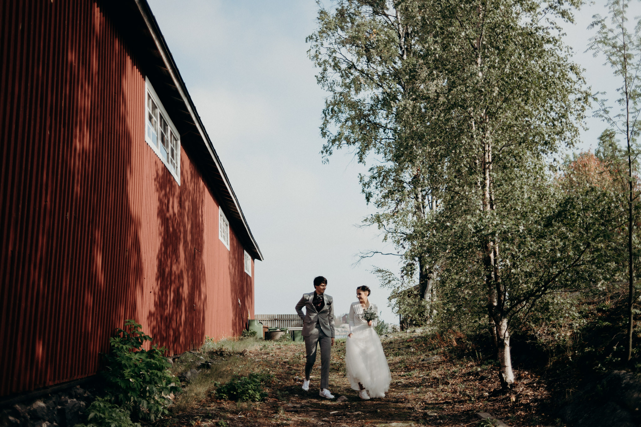 bride and groom standing by water, Helsinki wedding portraits